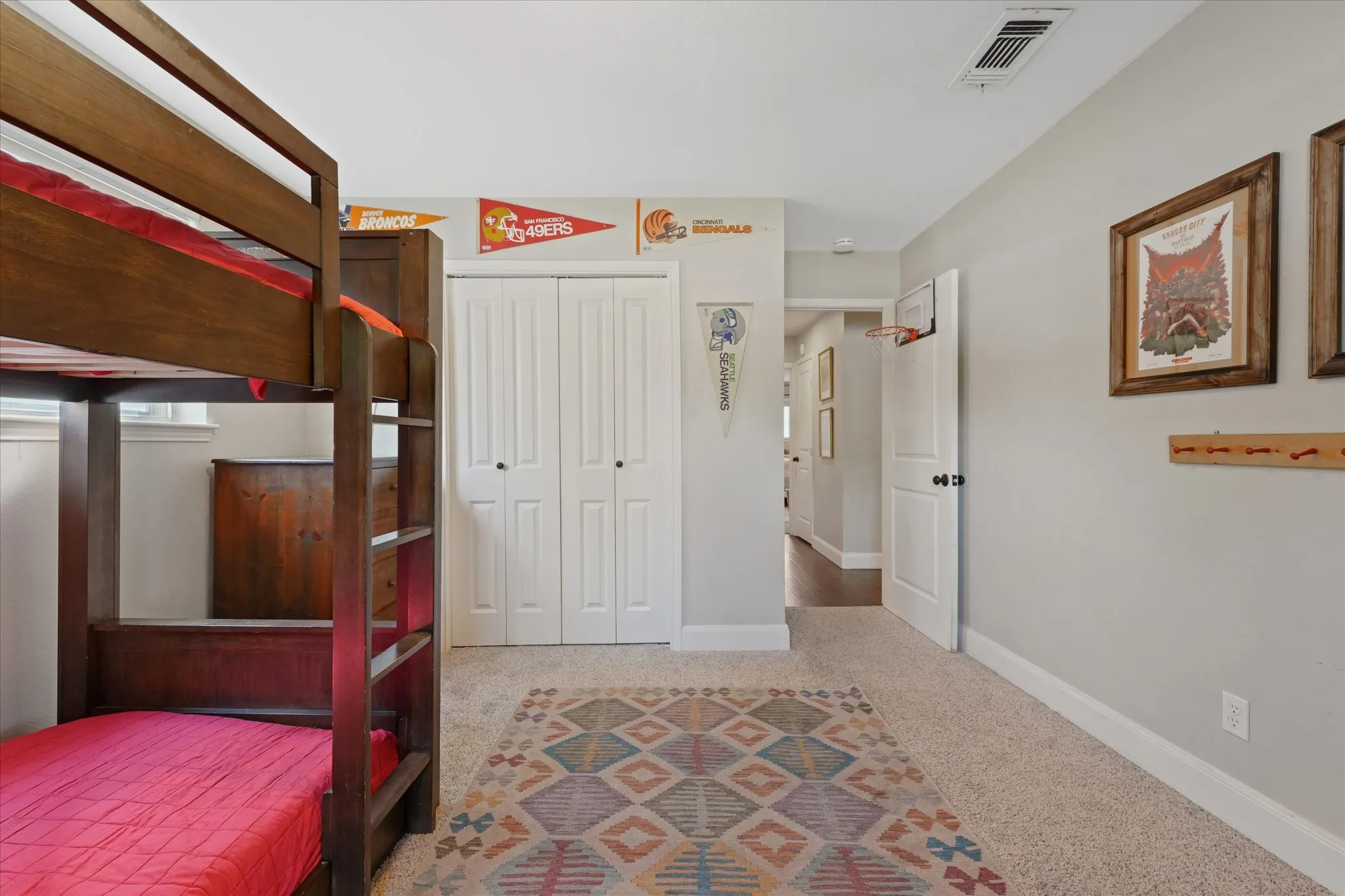 Additional view of the oversized secondary bedroom highlighting generous floor space, closet storage, and neutral décor ready for any style.