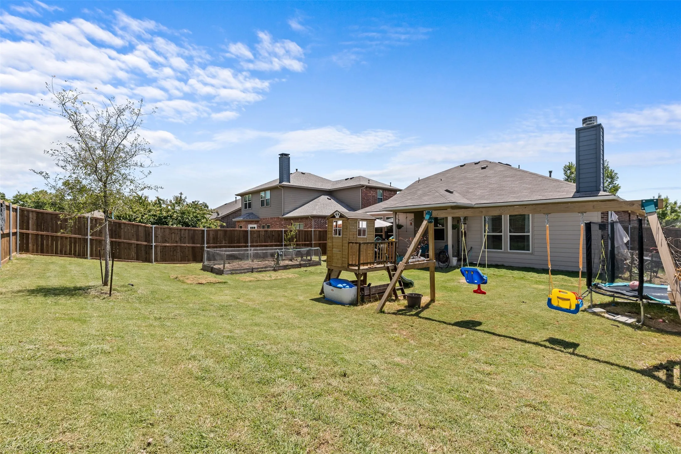 Room for swing set, trampoline + garden + space