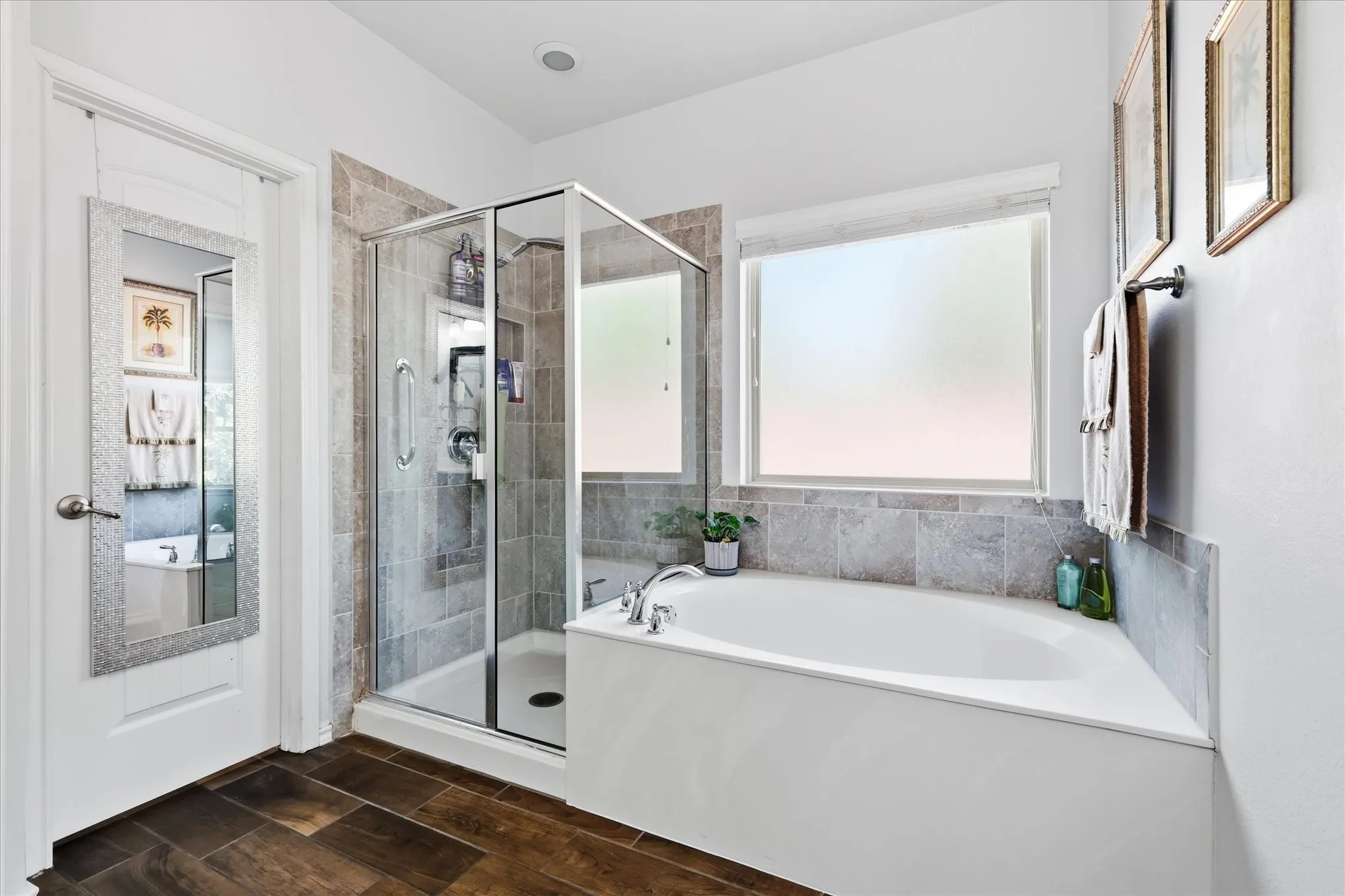 Primary bathroom with separate W.C., separate shower and tub and large walk-in closet