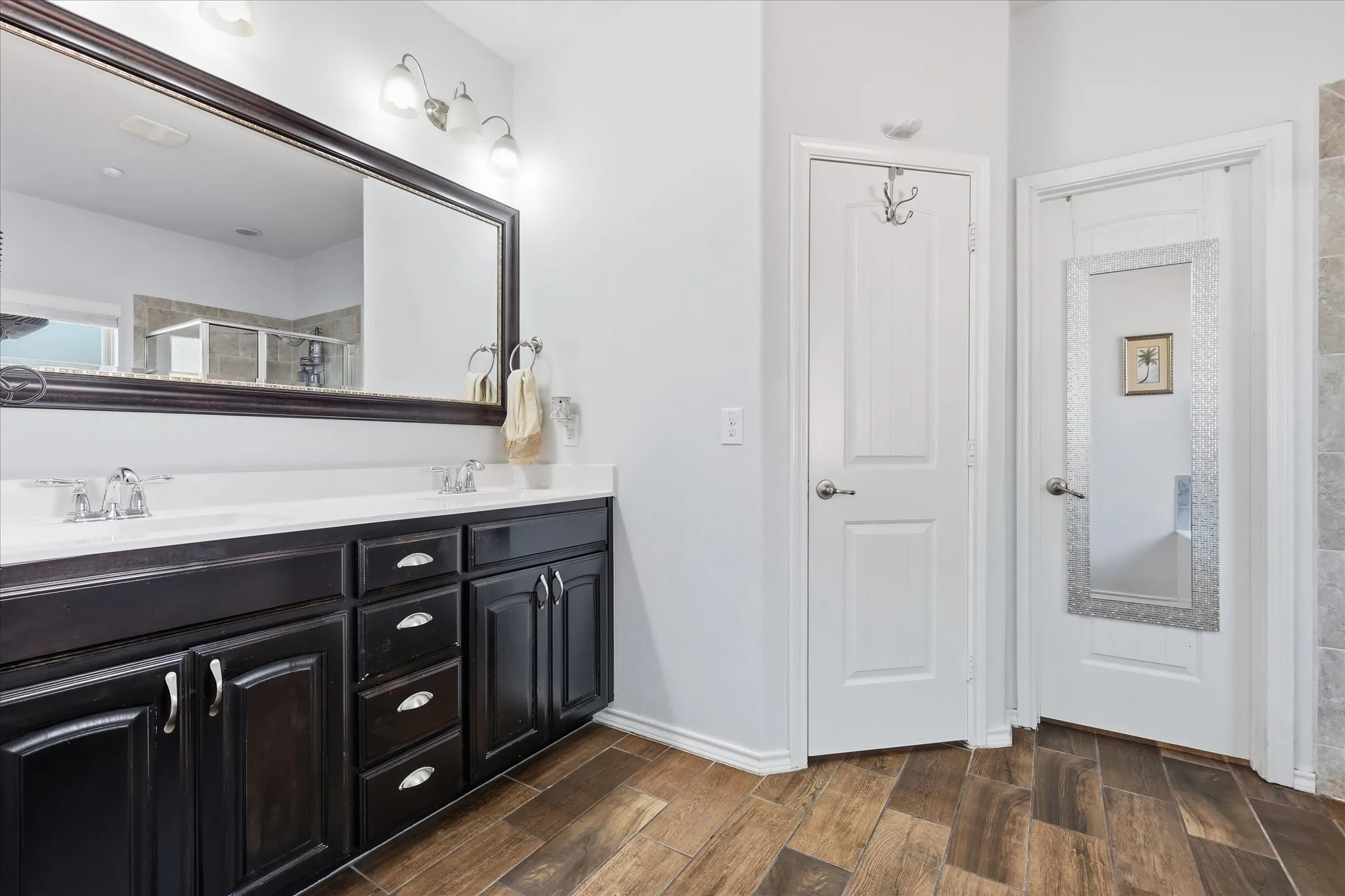 Primary bathroom with separate W.C., separate shower and tub and large walk-in closet