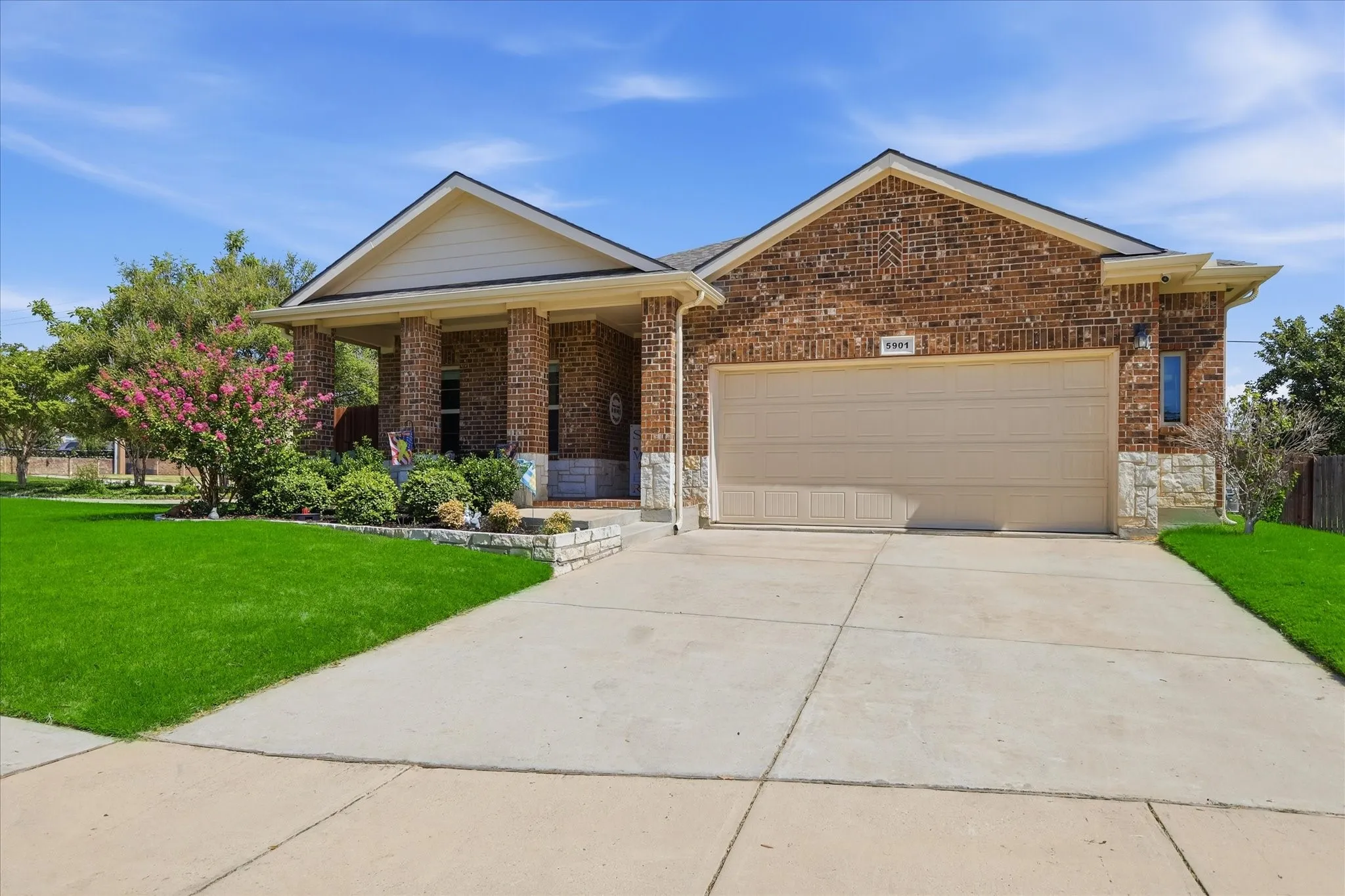 Front of home with covered front porch & 2 car garage