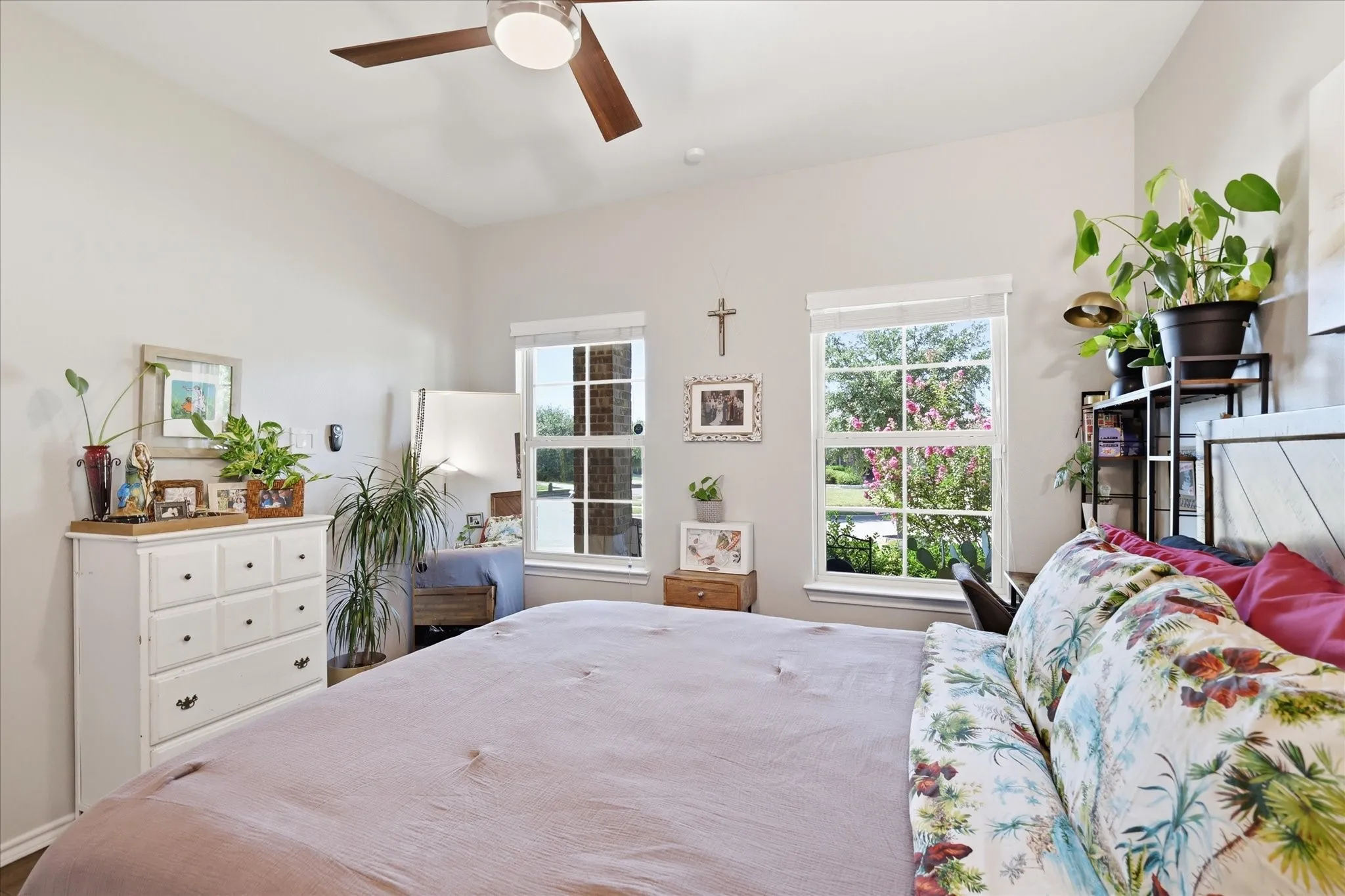 Front guest bedroom with updated wood look tile, added door to bathroom and ceiling fan with remote