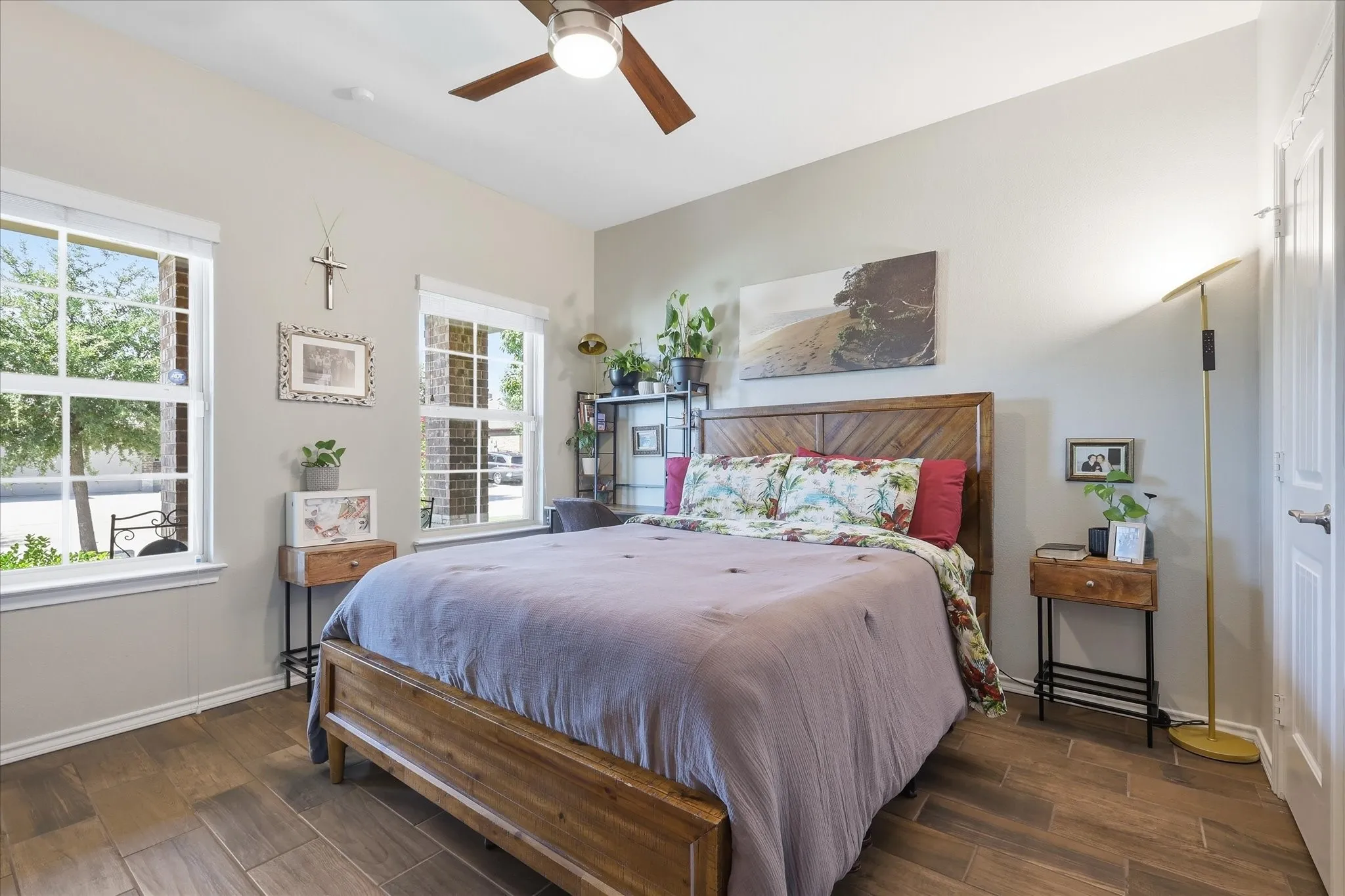 Front guest bedroom with updated wood look tile, added door to bathroom and ceiling fan with remote