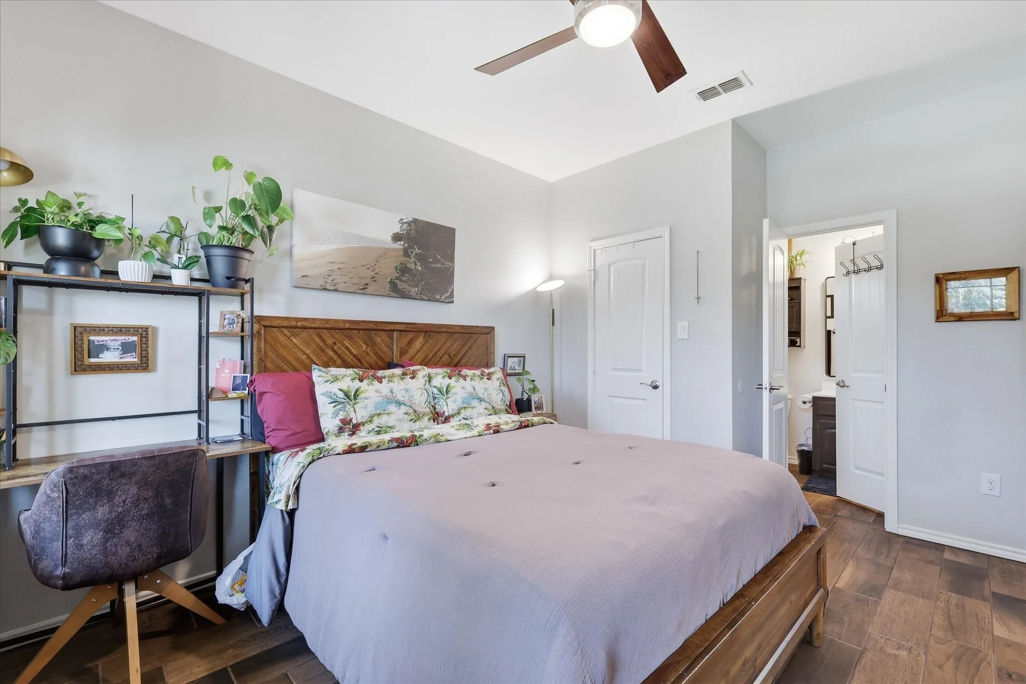 Front guest bedroom with updated wood look tile, added door to bathroom and ceiling fan with remote