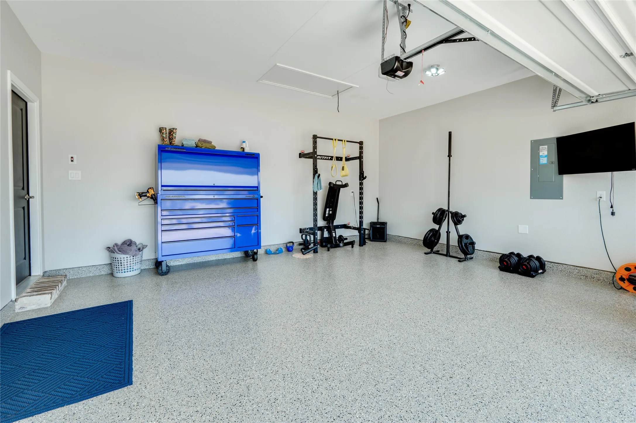 Oversized finished garage with Polyurea flooring.