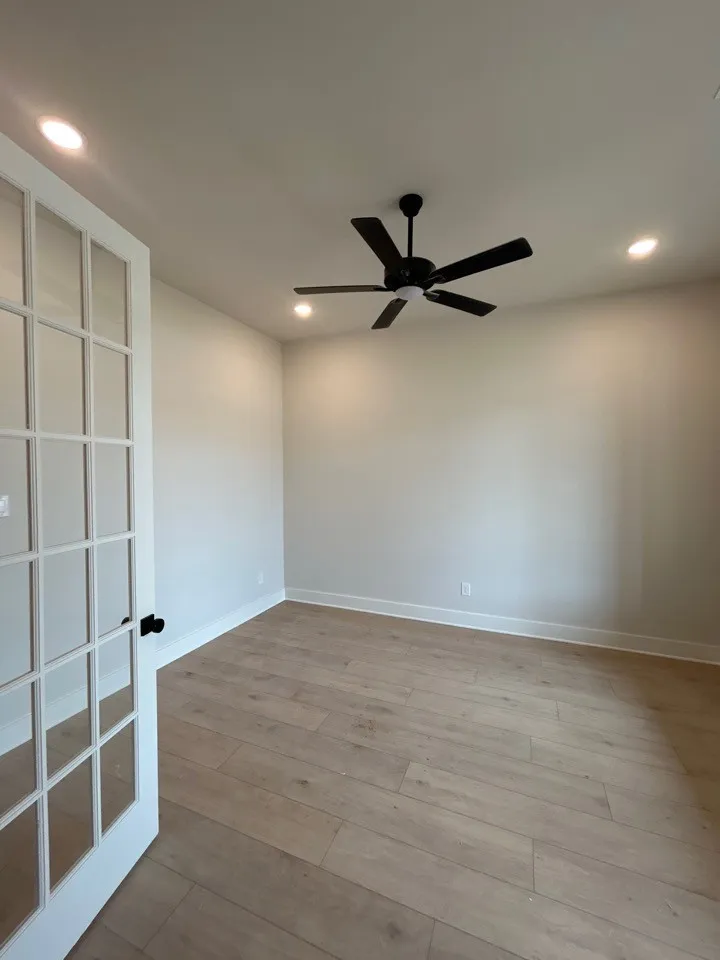 Light wood-finish flooring, recessed lighting, and a ceiling fan