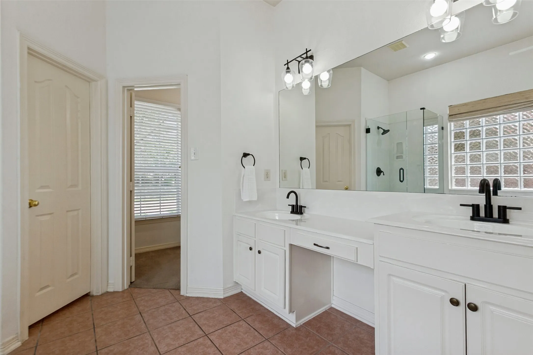 New primary bathroom hardware and refinished sinks and bathtub