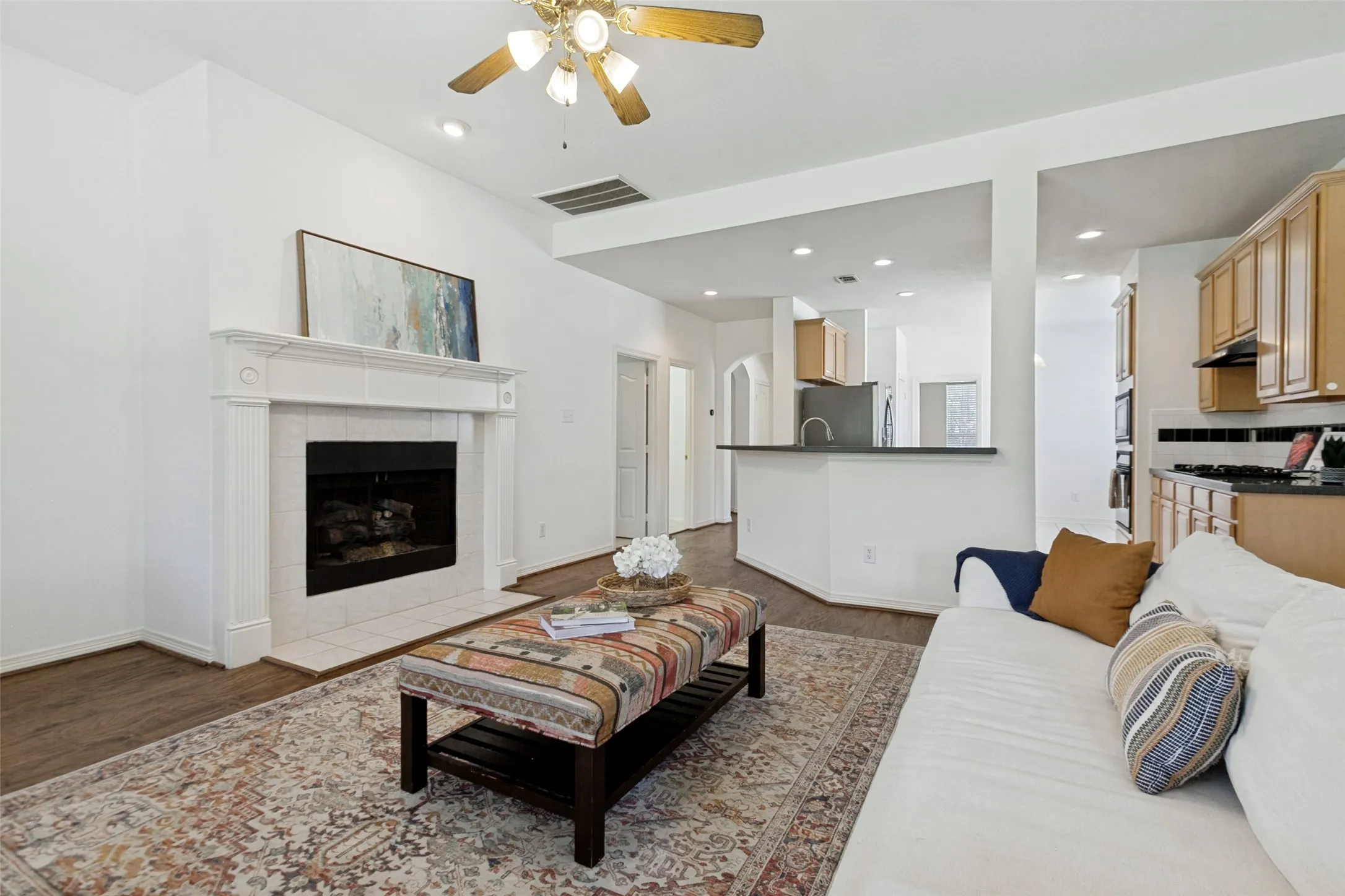 The open layout leads to the living room and kitchen