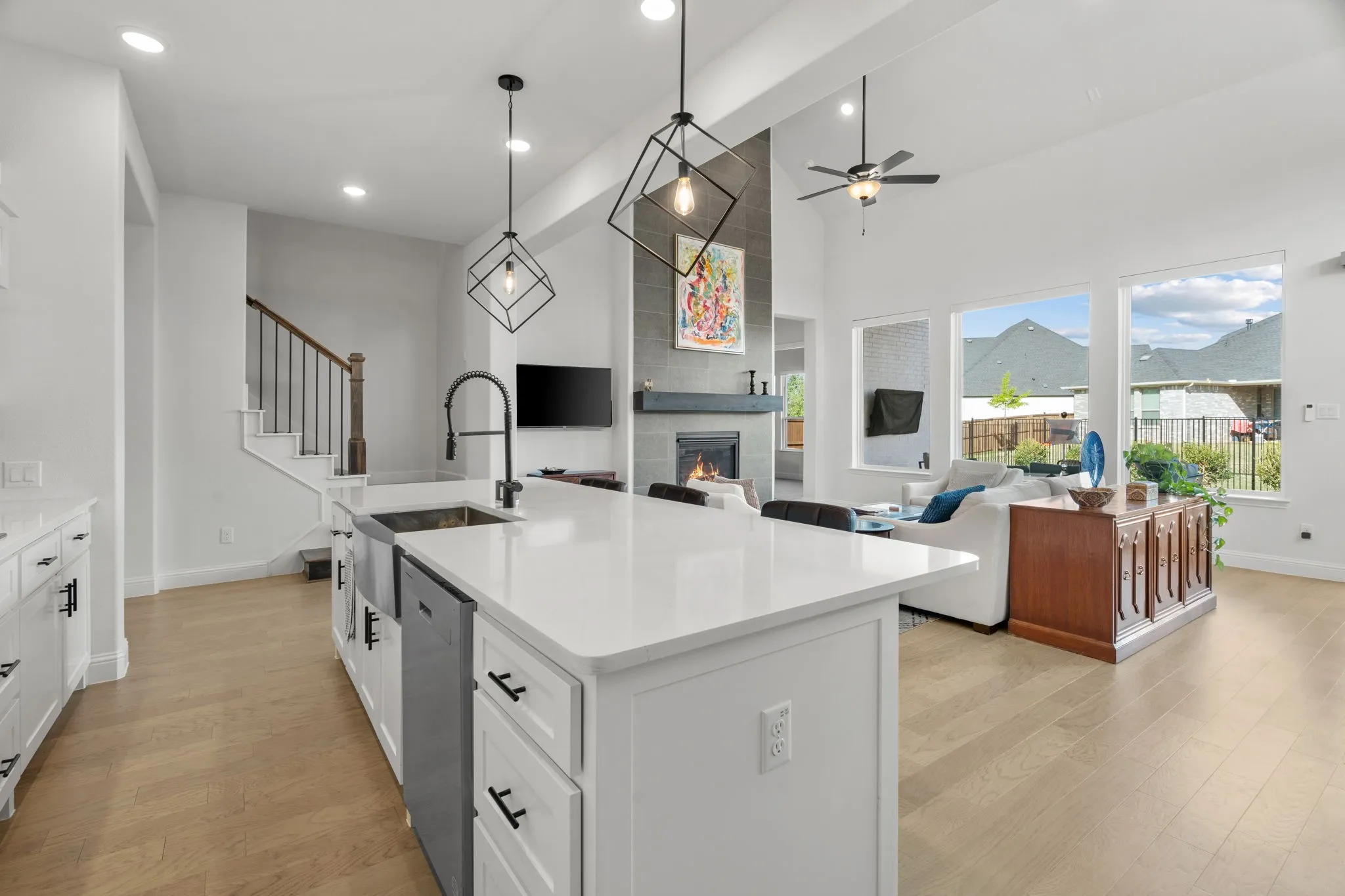 Open-concept living space featuring light wood-finish flooring throughout