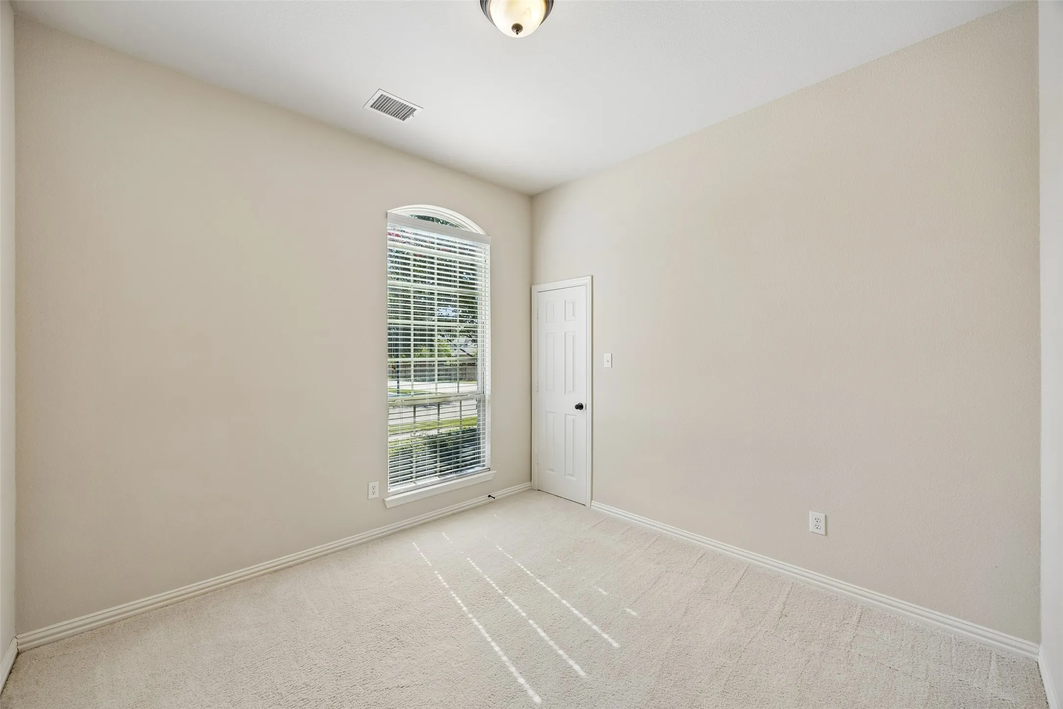 Secondary bedroom with large walk in closet