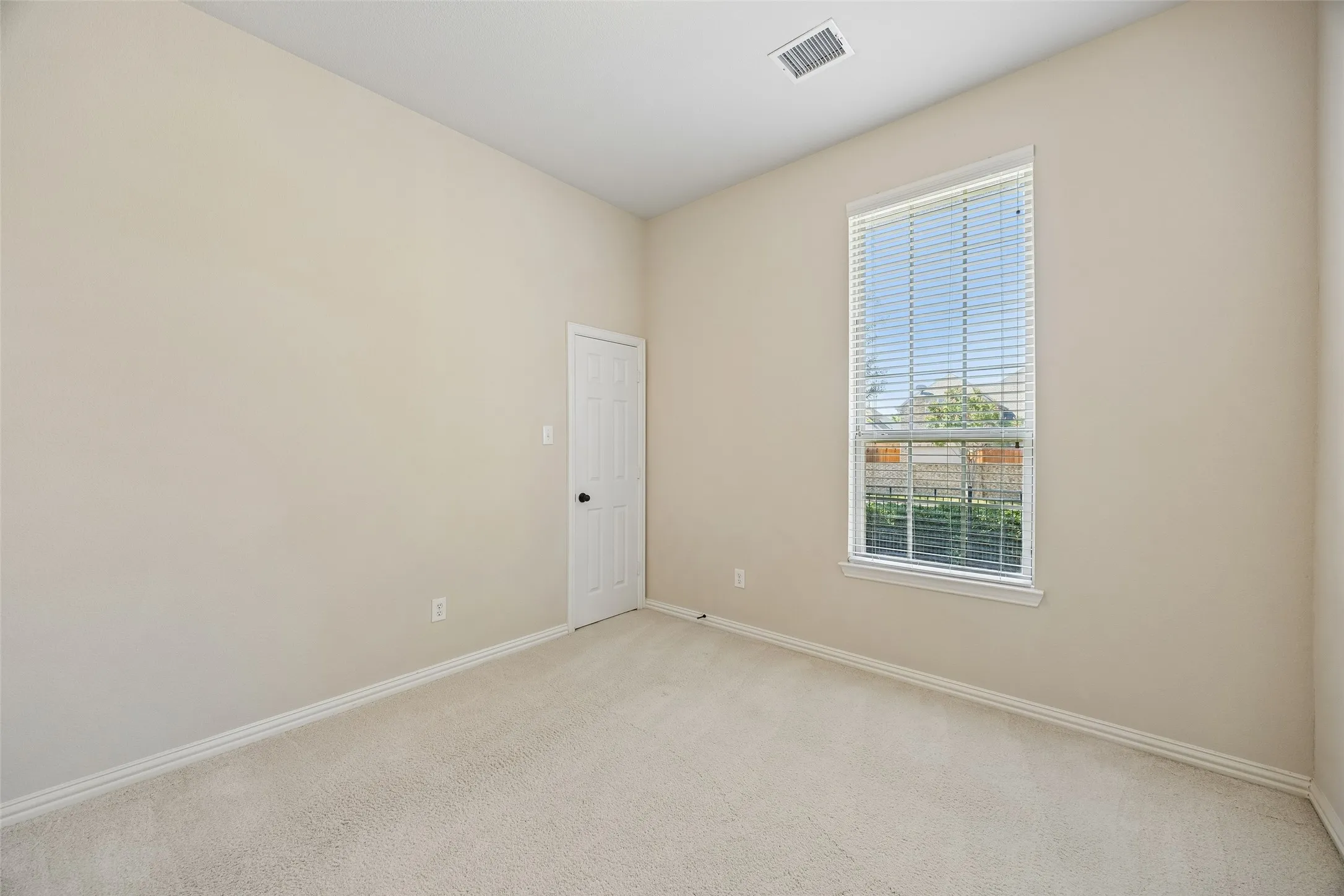 Secondary bedroom with large walk in closet