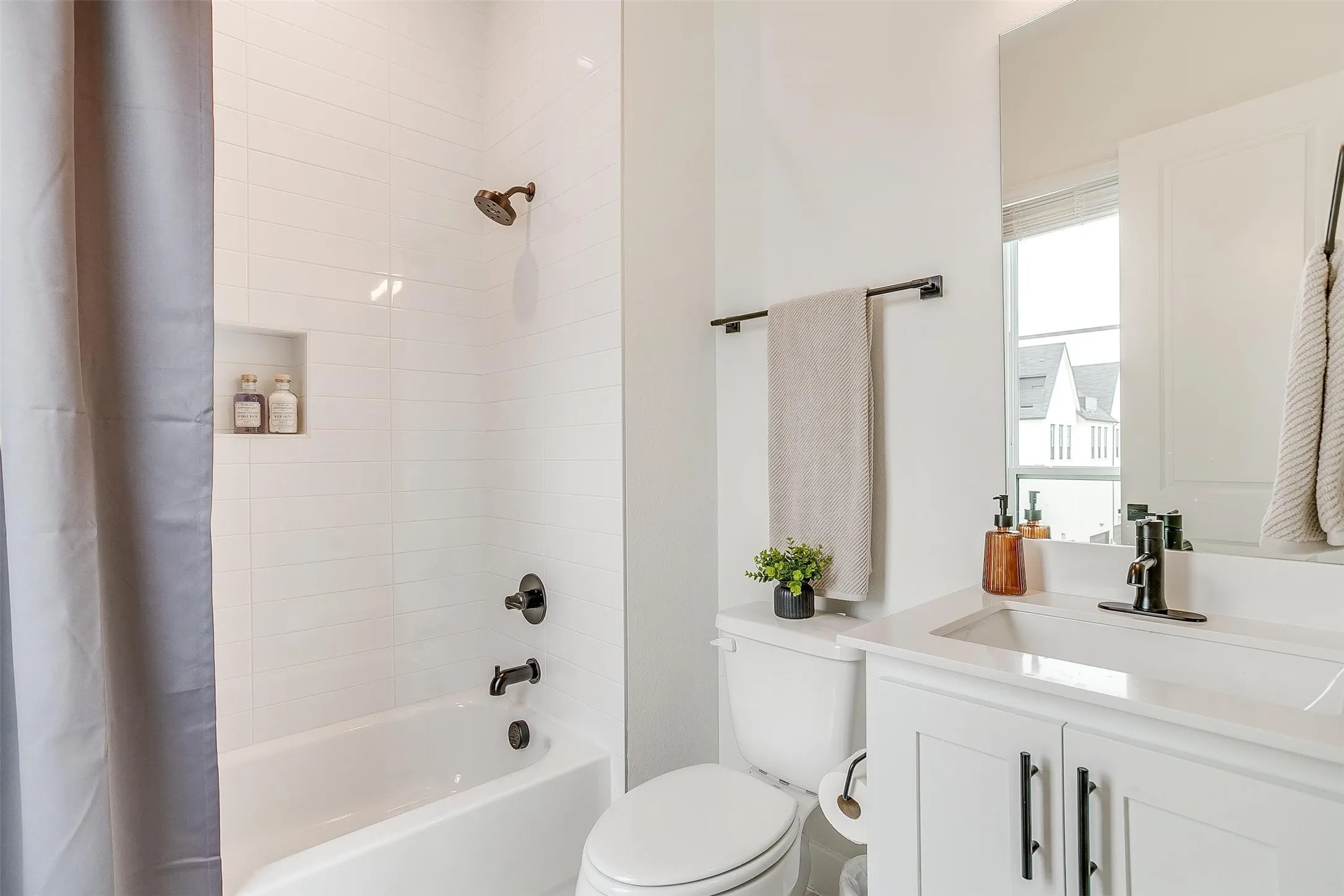 Full bathroom featuring shower / tub combo with curtain and vanity