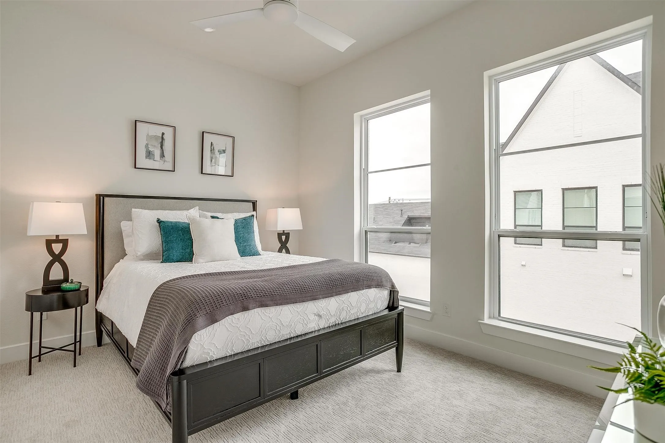 Bedroom with light carpet and ceiling fan