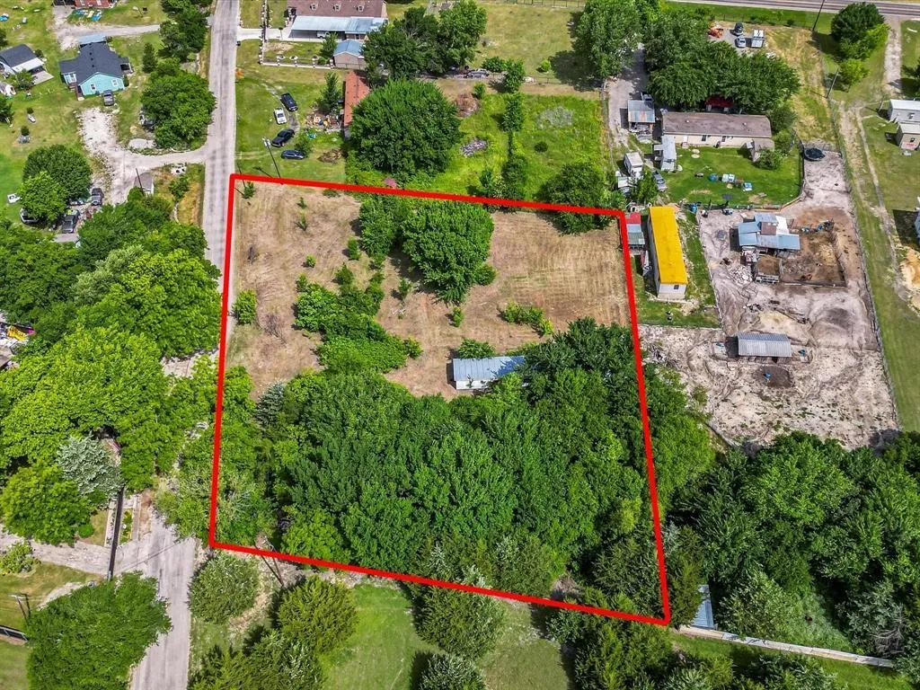 Expansive undeveloped parcel with a mix of mature trees and open clearings
