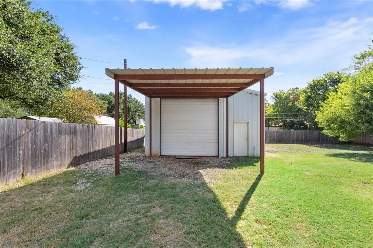 front shot of the 25'x32' workshop and the carport in front of it