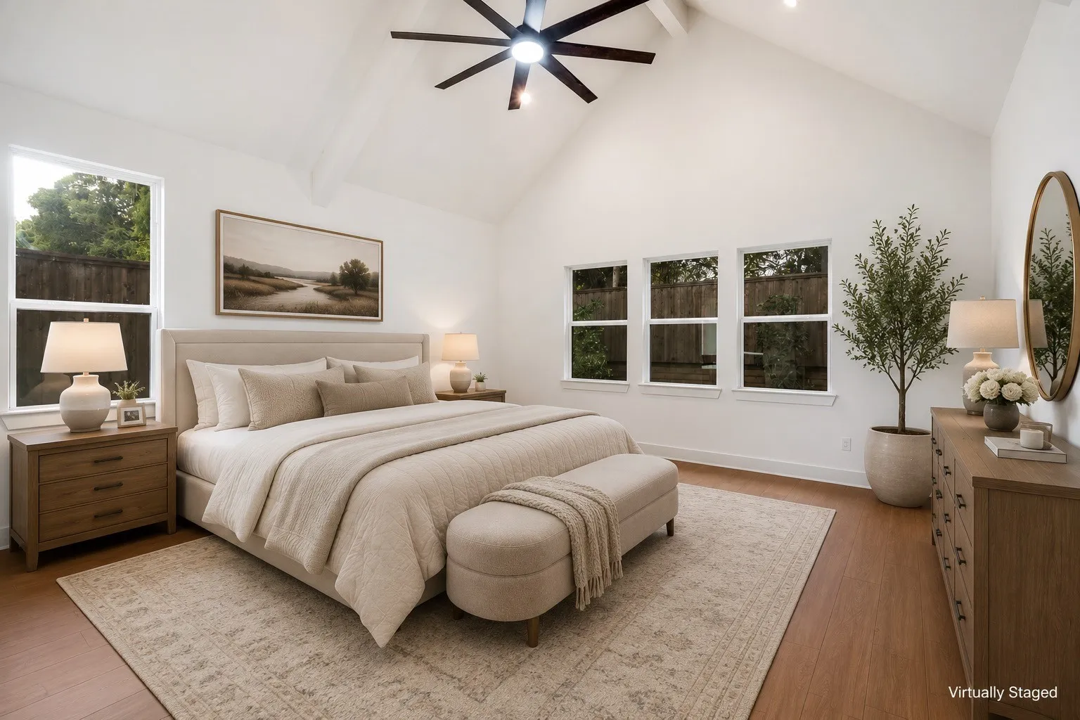 Vaulted ceiling with exposed beam and ceiling fan