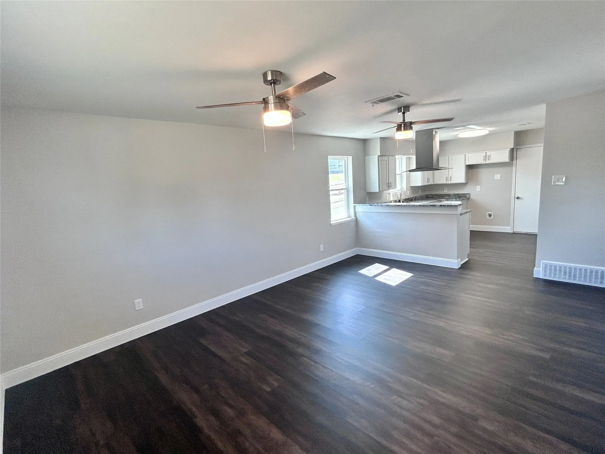 View of dining area leading to kitchen.