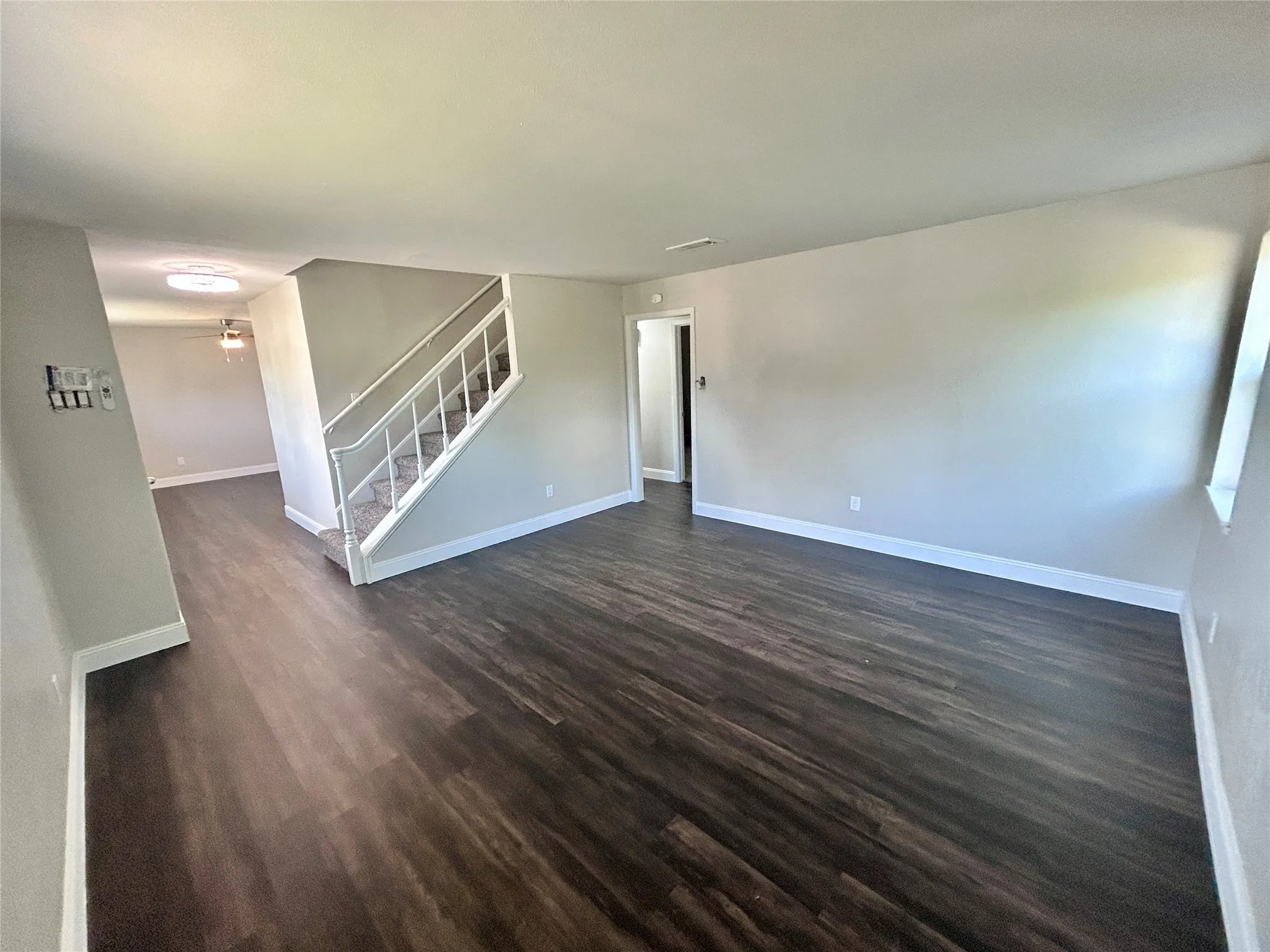 A different view of living area leading to formal dining area.