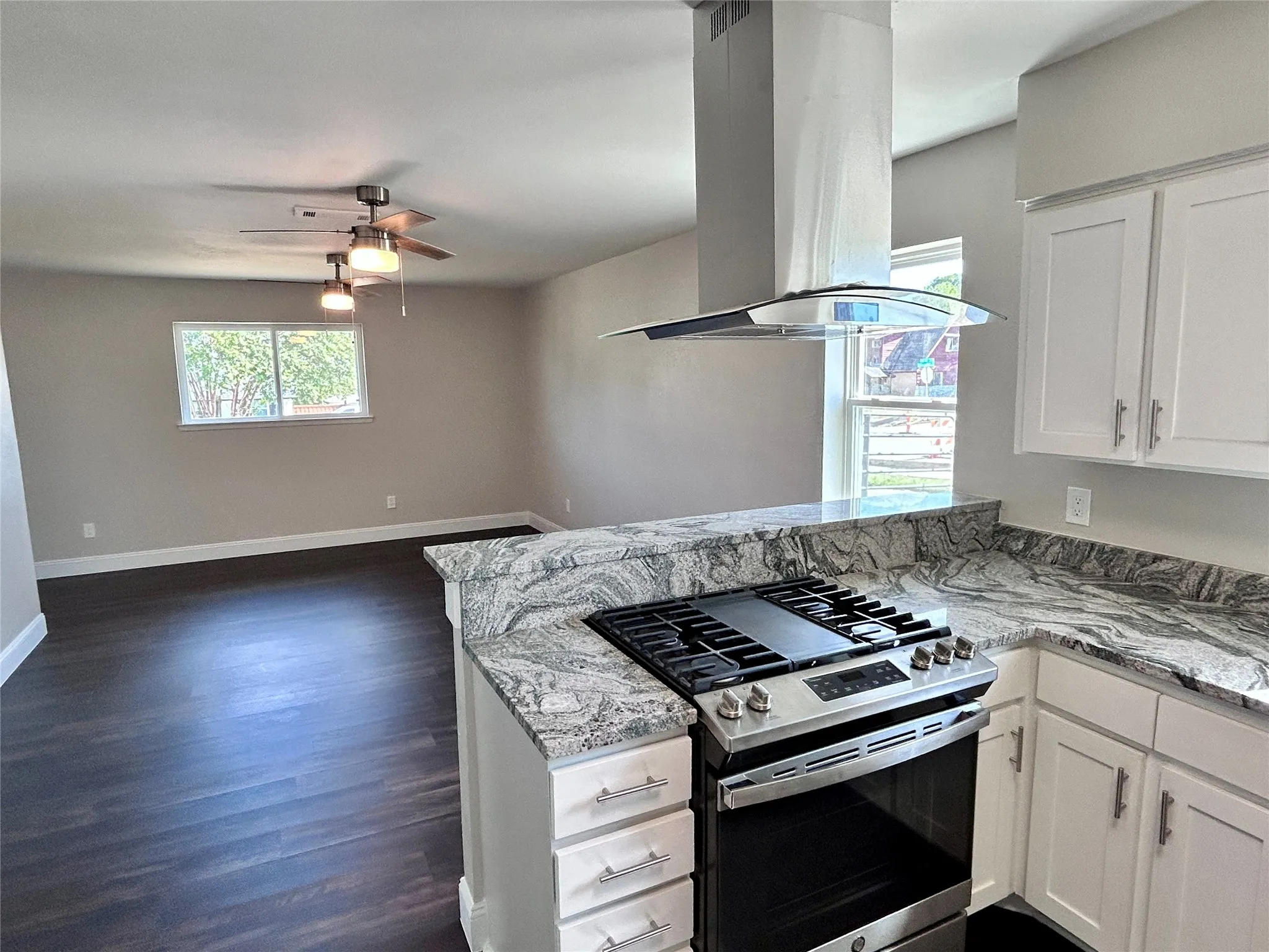 Another view of the kitchen leading into formal dining area.