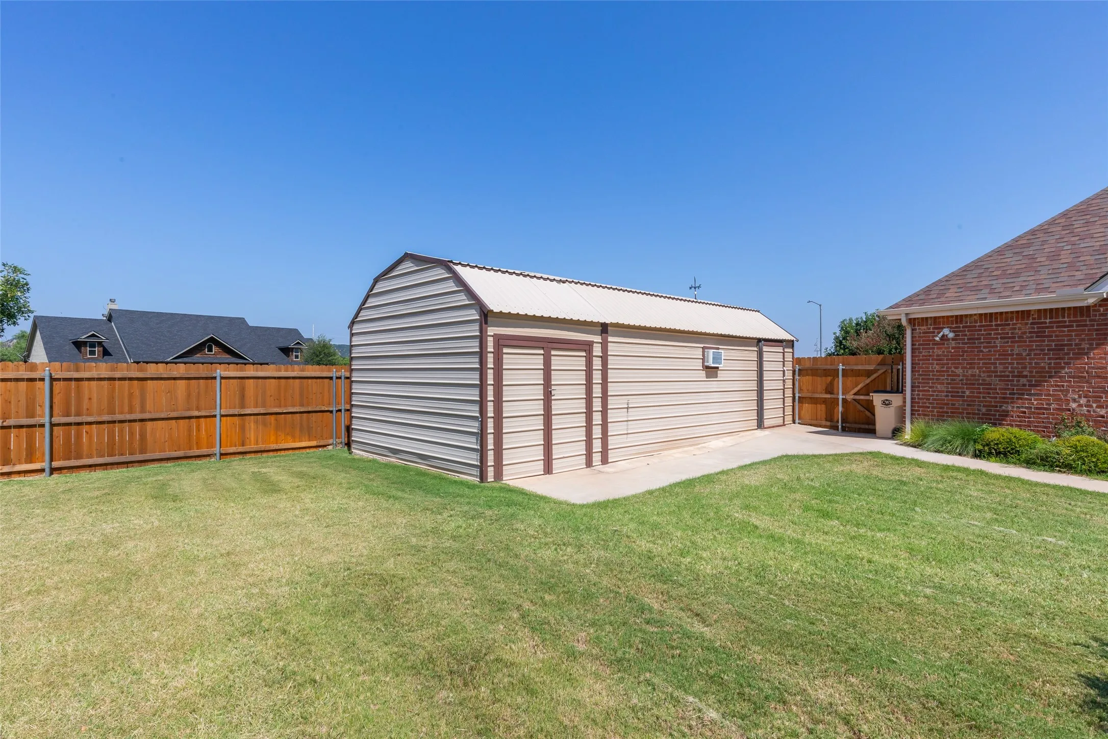 Large workshop has a/c units, is approximately 24 x 14 and has a separate storage room attached that is approximately 8 x 14