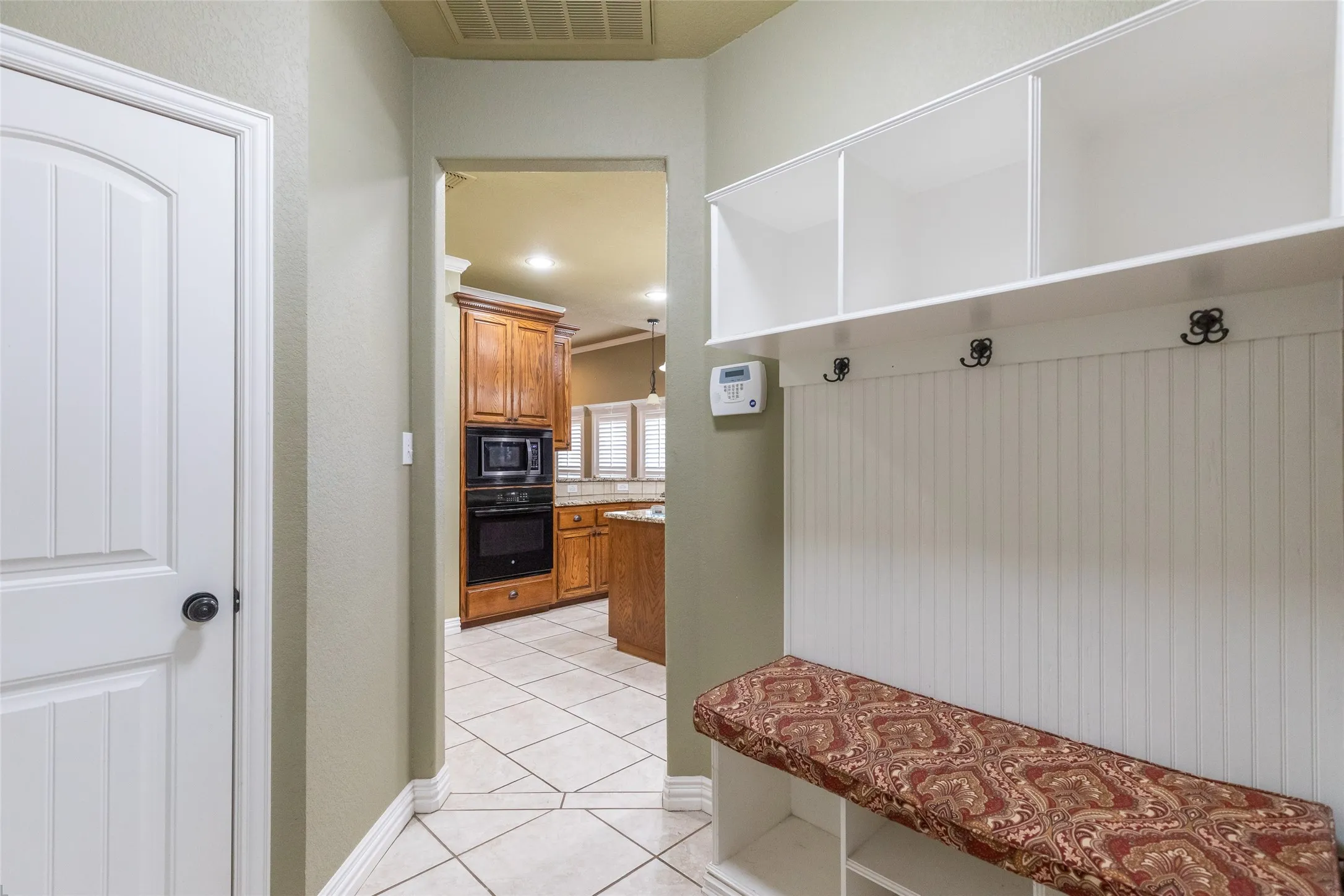 Mud room located outside of kitchen near the utility room and garage