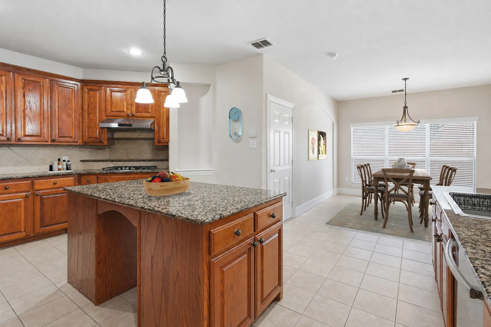 Kitchen With A Few Items That Were Added Virtually.  Breakfast Room Which Has Been Virtually Staged.