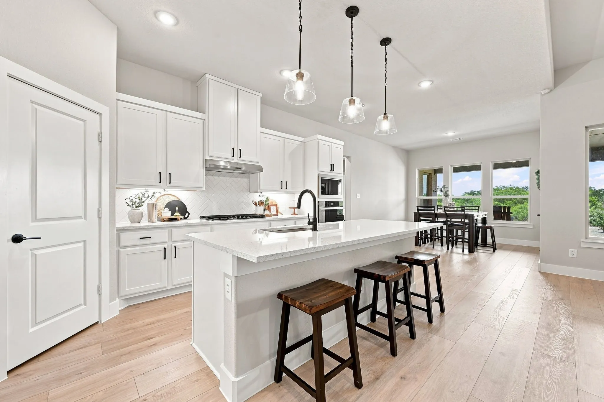 The spacious kitchen island is perfect for meal prep and visiting.