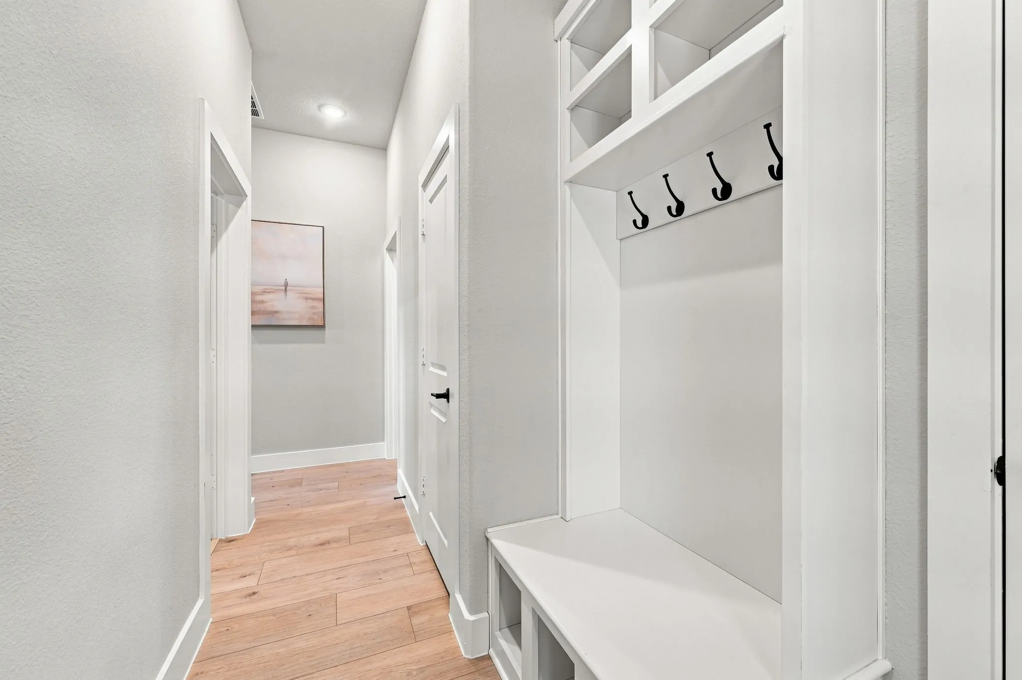 Perfect space to hang ethe backpacks or put your shoes as you come in from the garage.