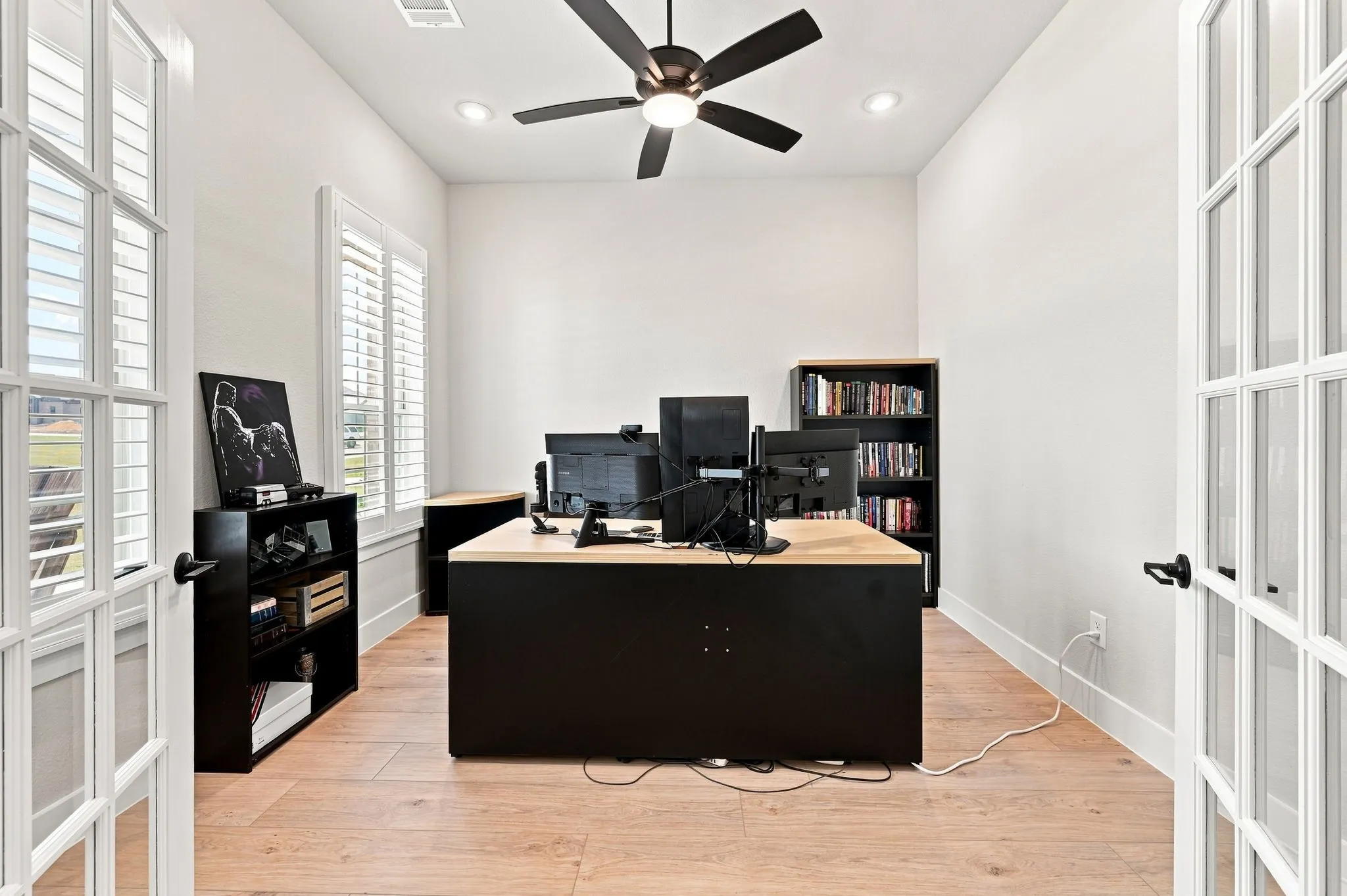 Off the entry, is the home office with french doors.