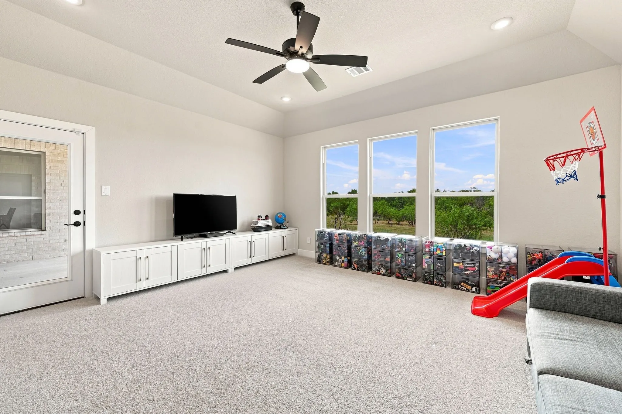 The game room also has a door that leads to the patio.