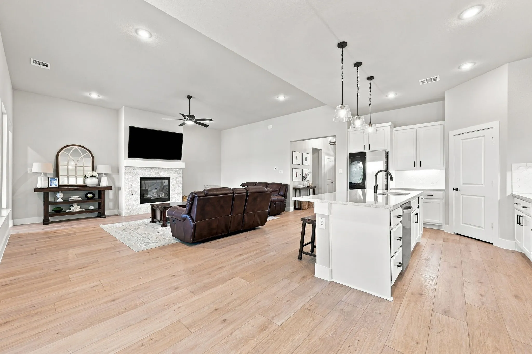 What a great living room to hang out in. Notice the LVP flooring through this space.
