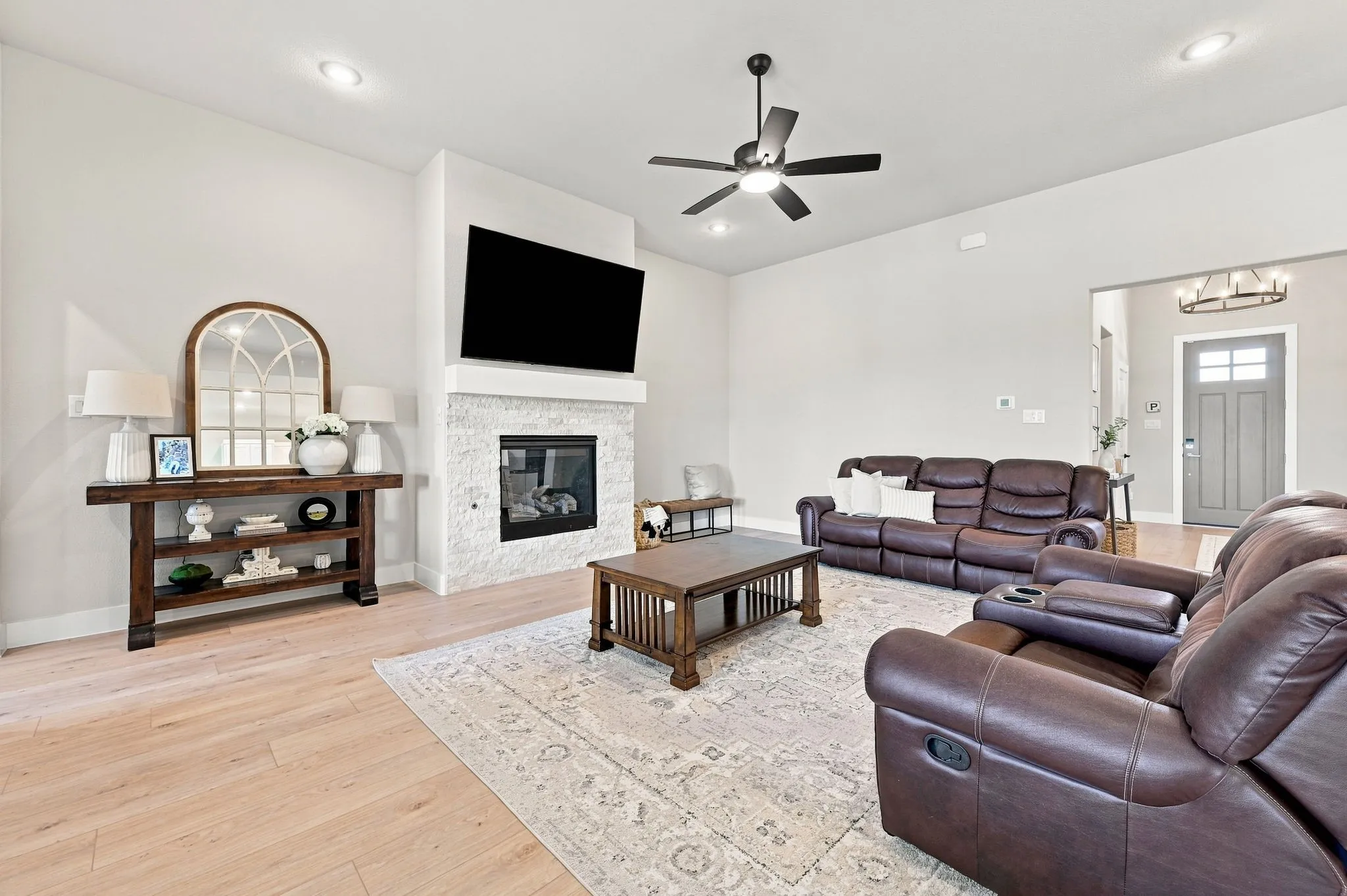 The gas fireplace has a decorative surround and gas logs.