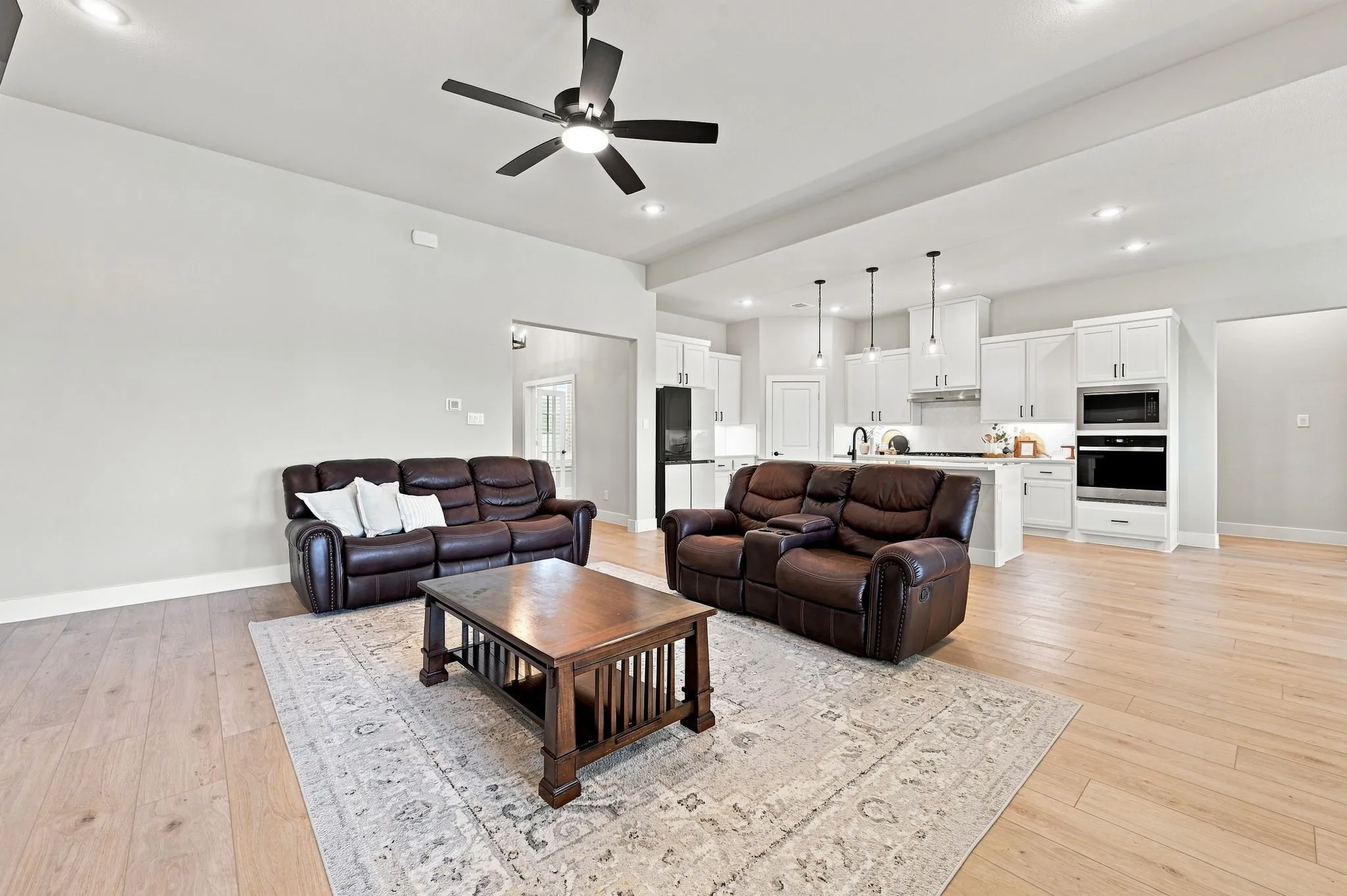 Anotherview showing off the open concept plan. Ceiling fans thoughout this home.