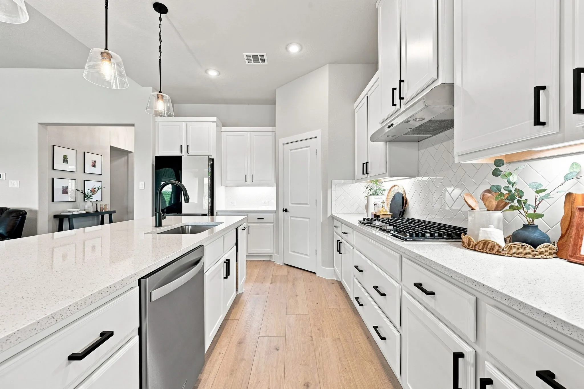Lots of counter space, pull out trash drawer and walk in pantry.