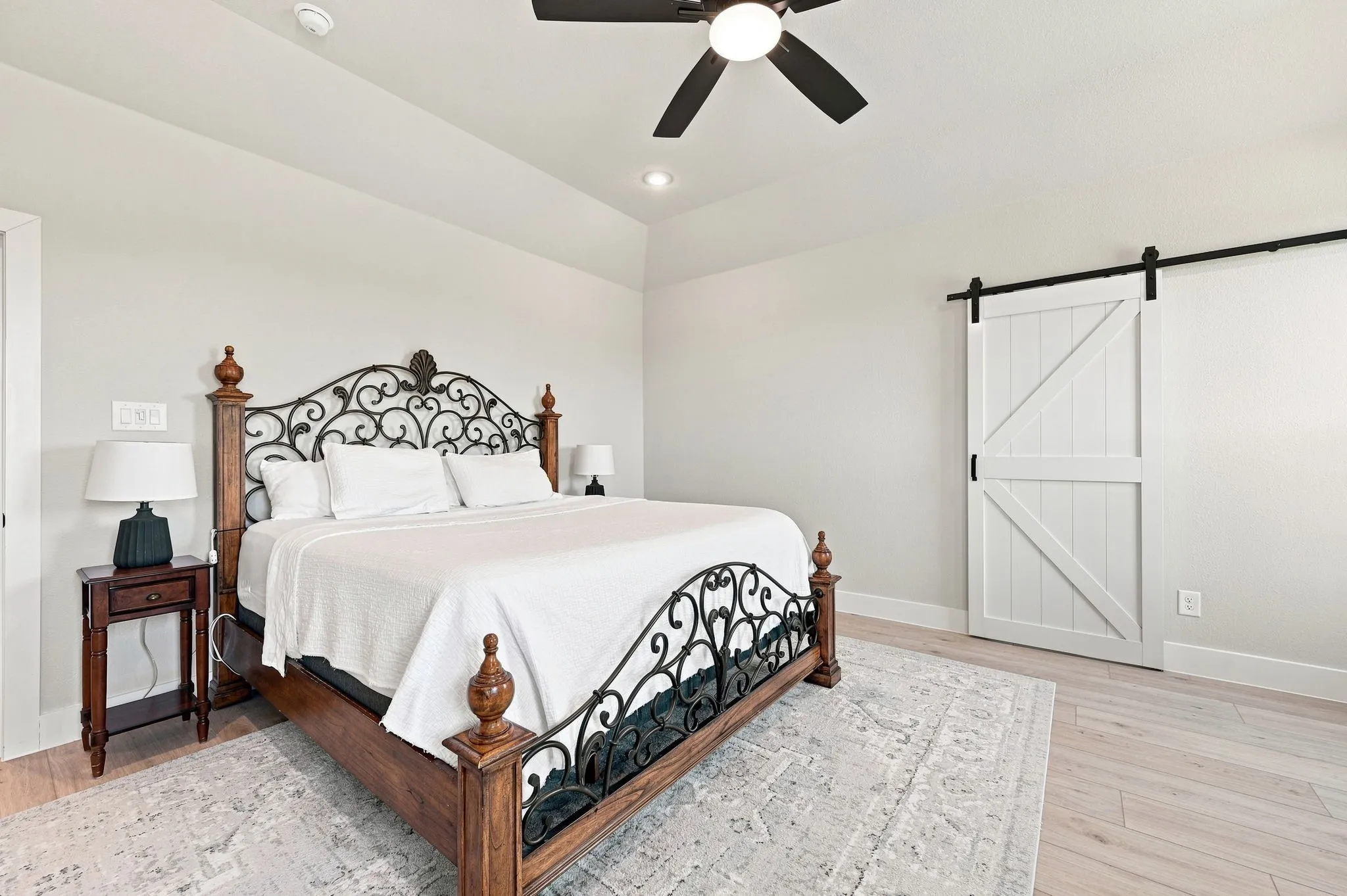 Love the barn doors that lead to the en suite bath.