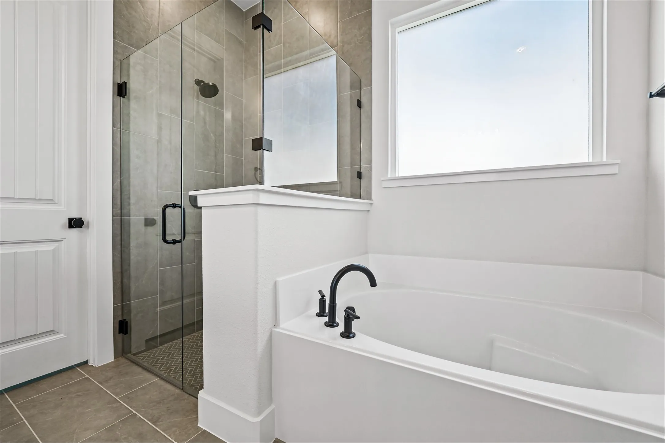 Soaking tub with matte black fixtures