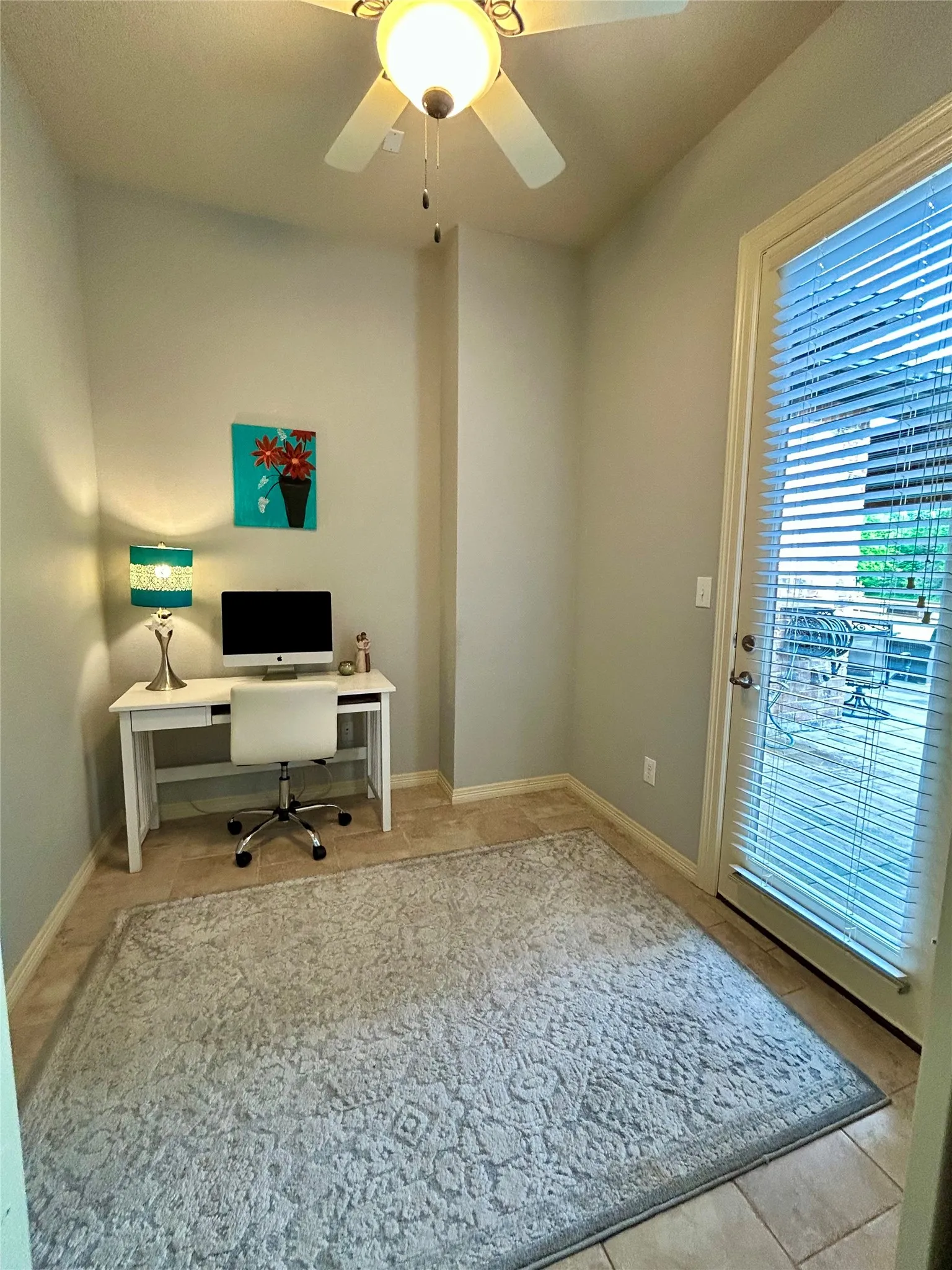 This flex space in the Main Primary suite has an exterior door to the backyard. This space could be a nursery, a study area, or another walk in closet.