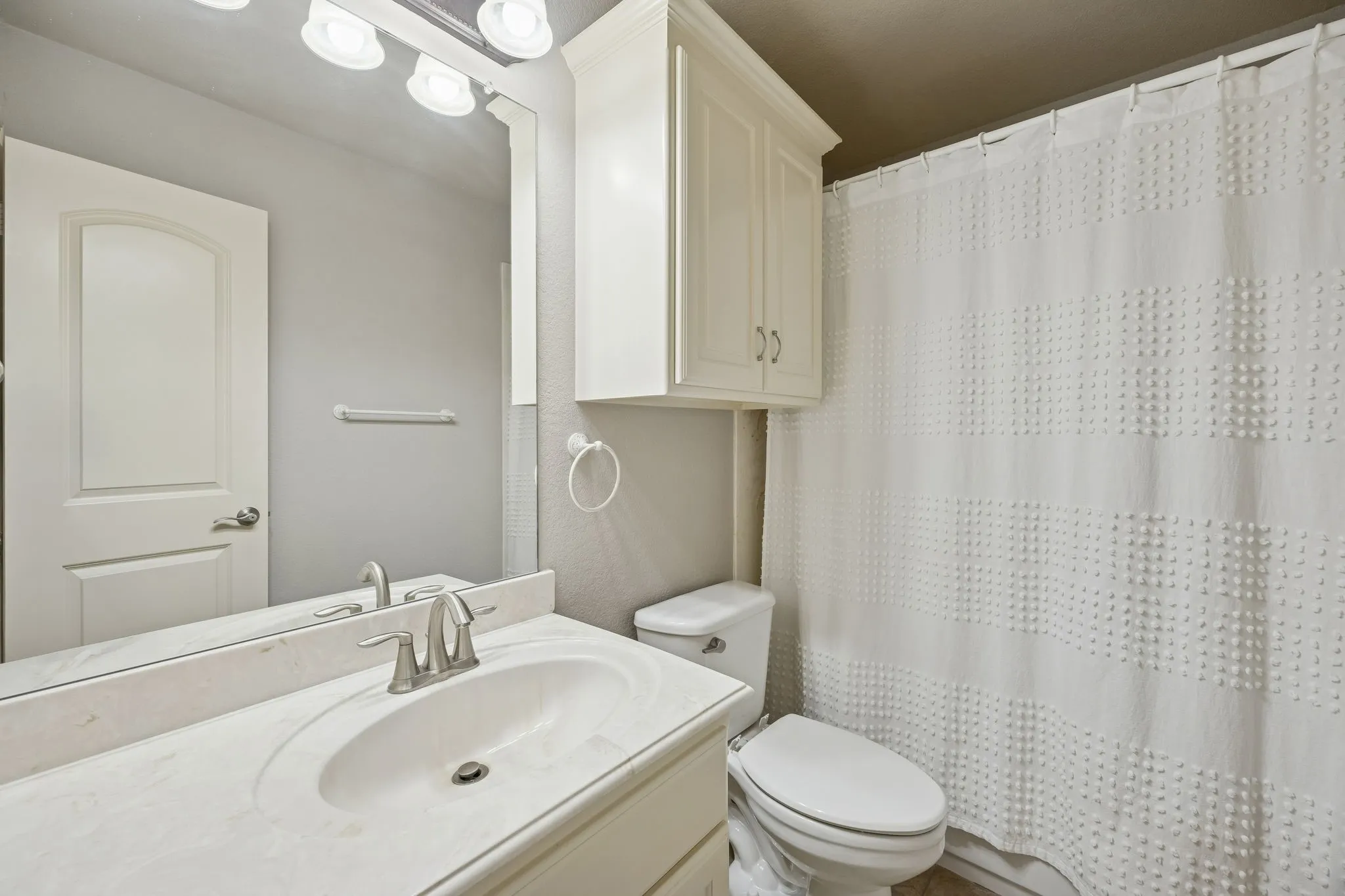 2nd floor hall bathroom with tub and shower services bedroom 3 and guests visiting the upstairs entertainment rooms.