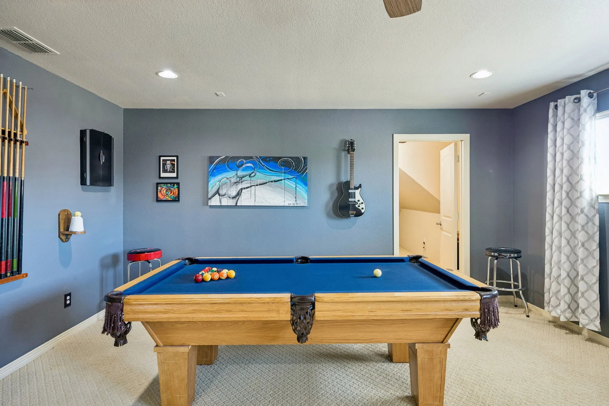 Game room is large enough to house a pool table and TV room.