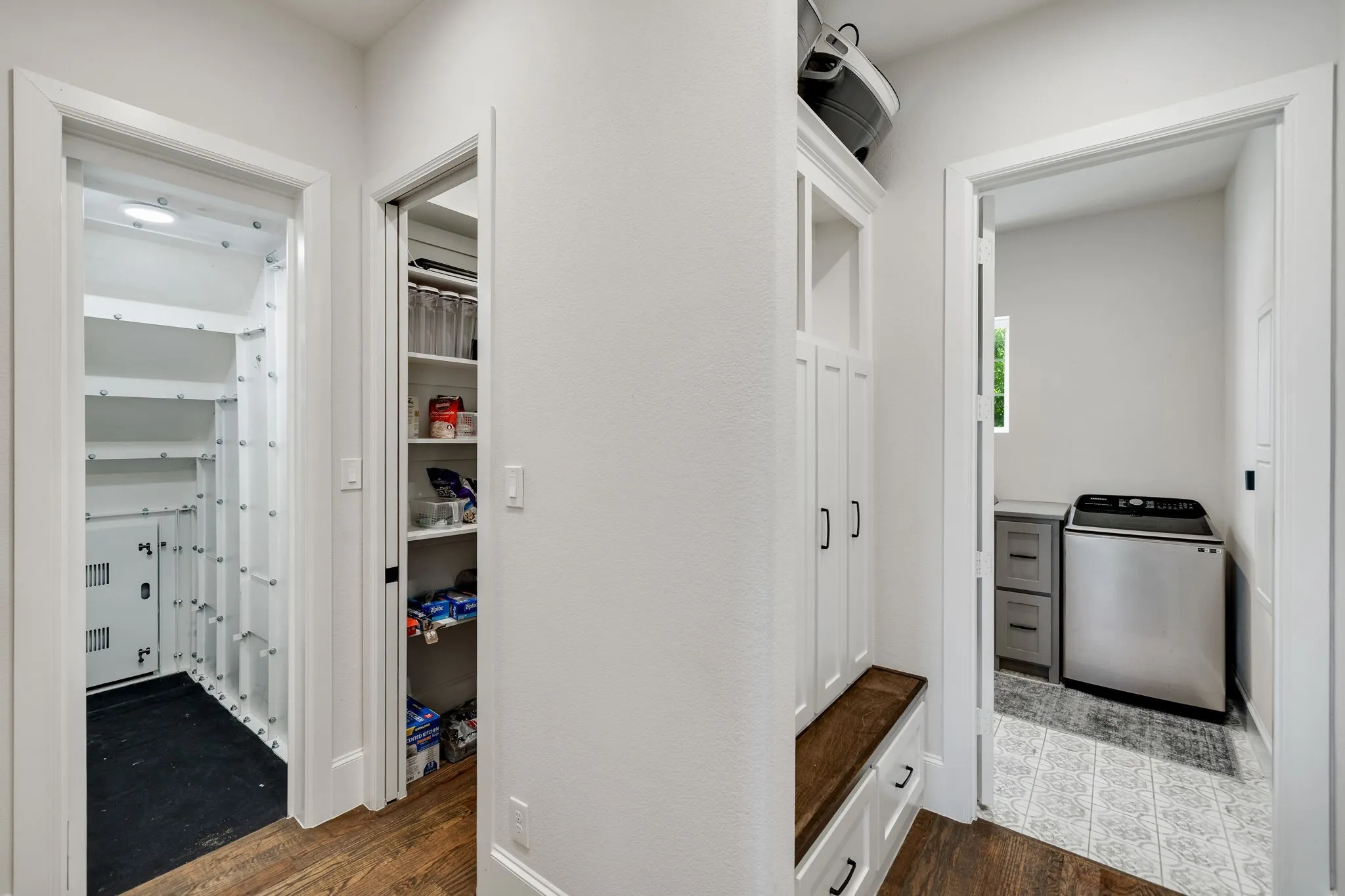 Beyond kitchen with access to a safe-room with extra storage, the pantry, a mud room and the laundry room