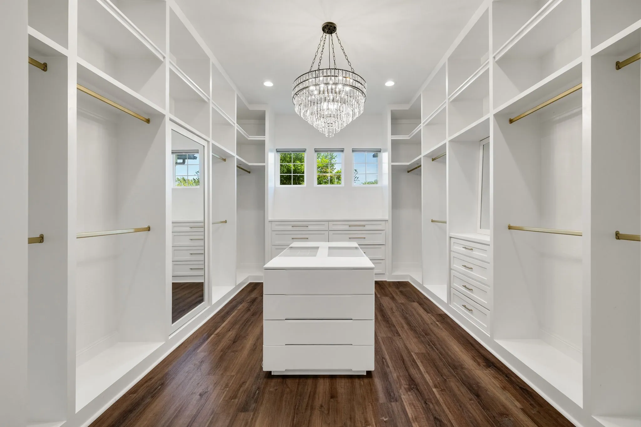 Neutral wall tones with recessed lighting and a ceiling fan