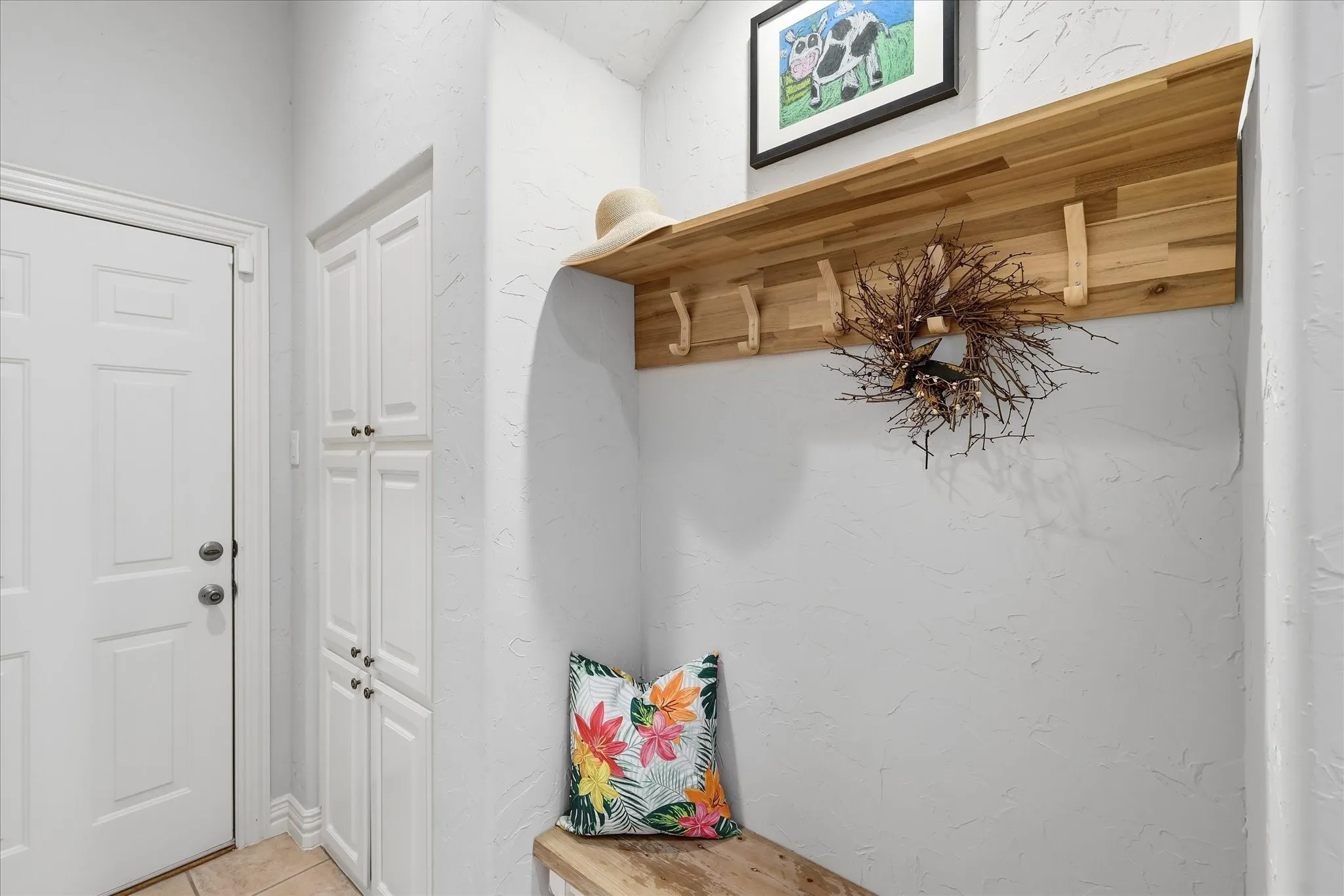 That contains the conveniently placed mudroom. Just the place for all those items as you come in from the garage. Closets in the corridor too.