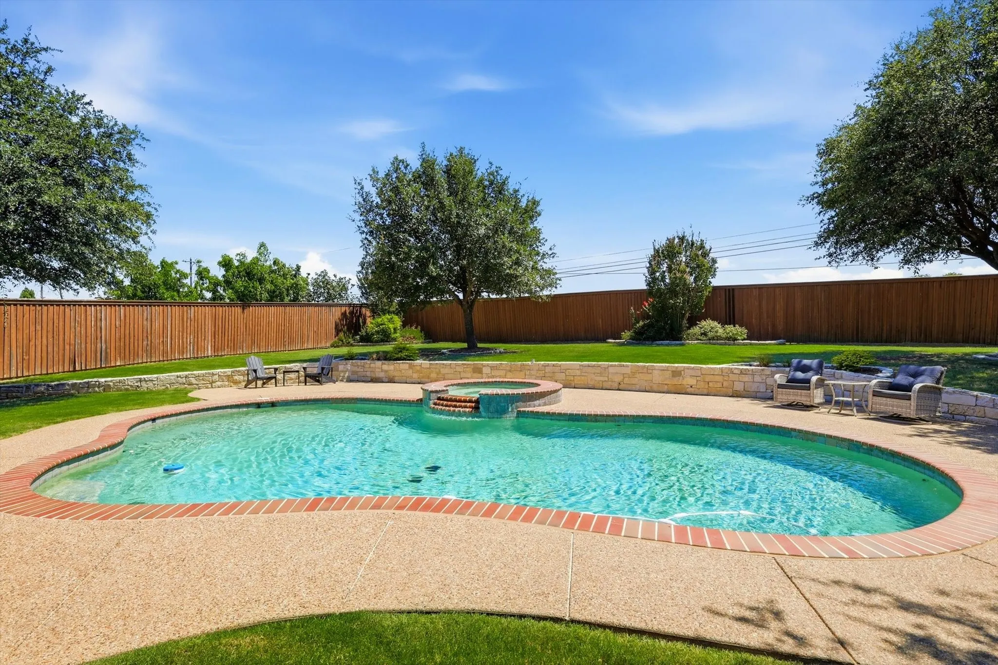 And the sparkling pool. Inviting with multiple sit down areas and with spa and water feature