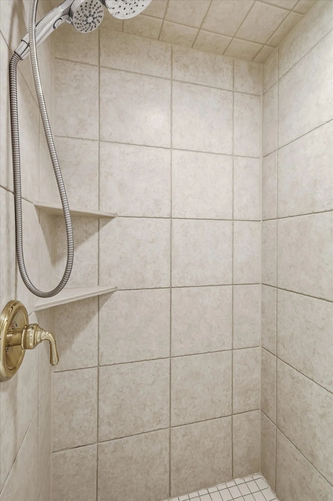 And a full view of the shower with conveniently placed shelves