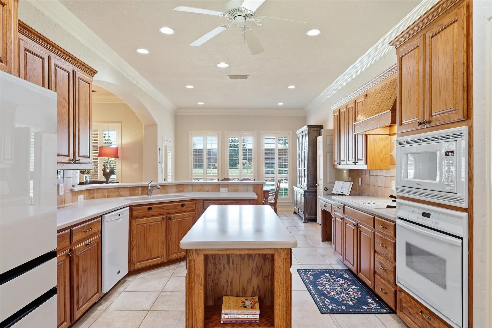 Kitchen open to family room. Center Island and full of light internally but also from the windows that look out onto the picturesque backyard