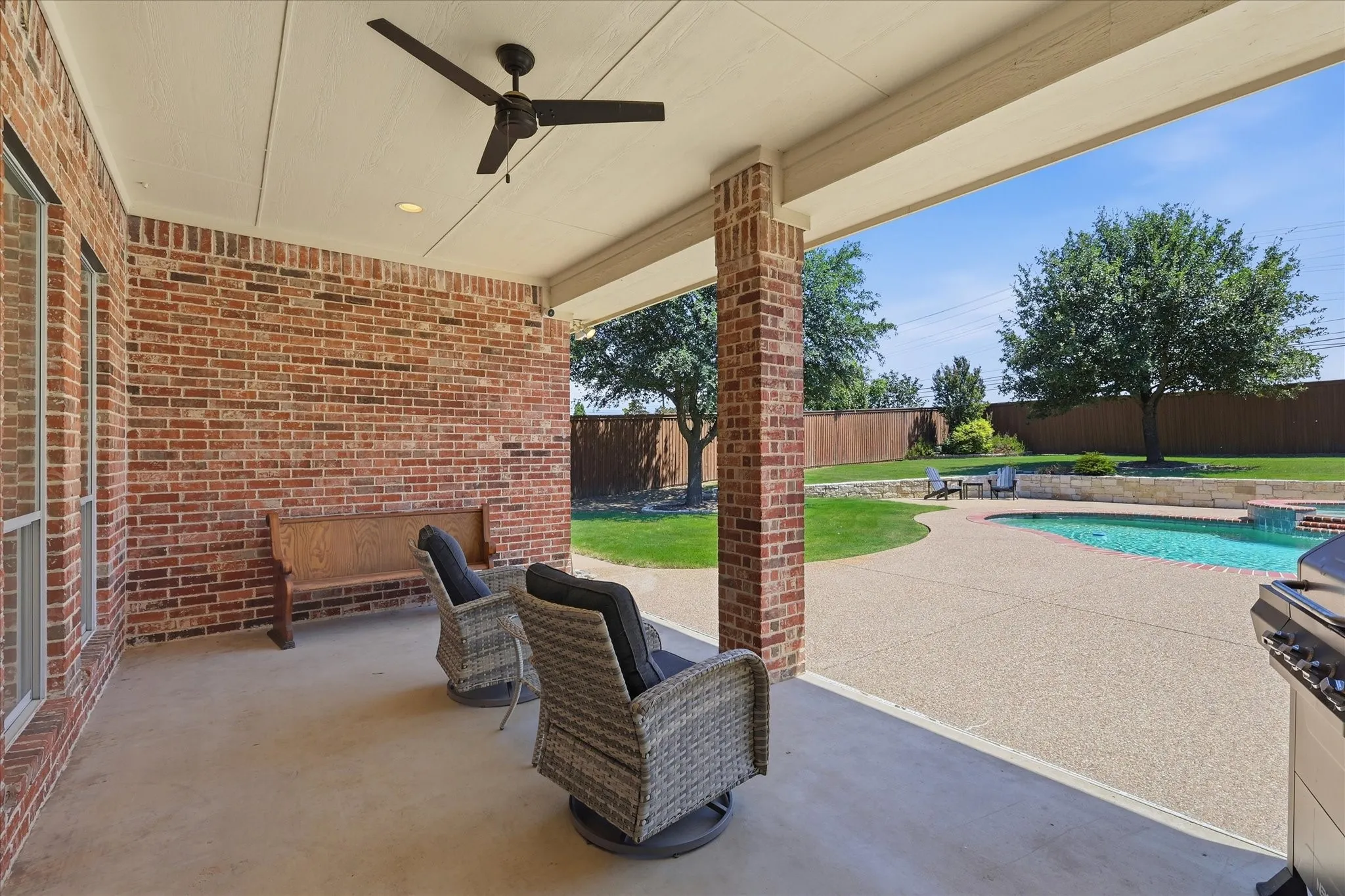 Covered back patio . A great place to relax at the end of the day. Ceiling fan too.
