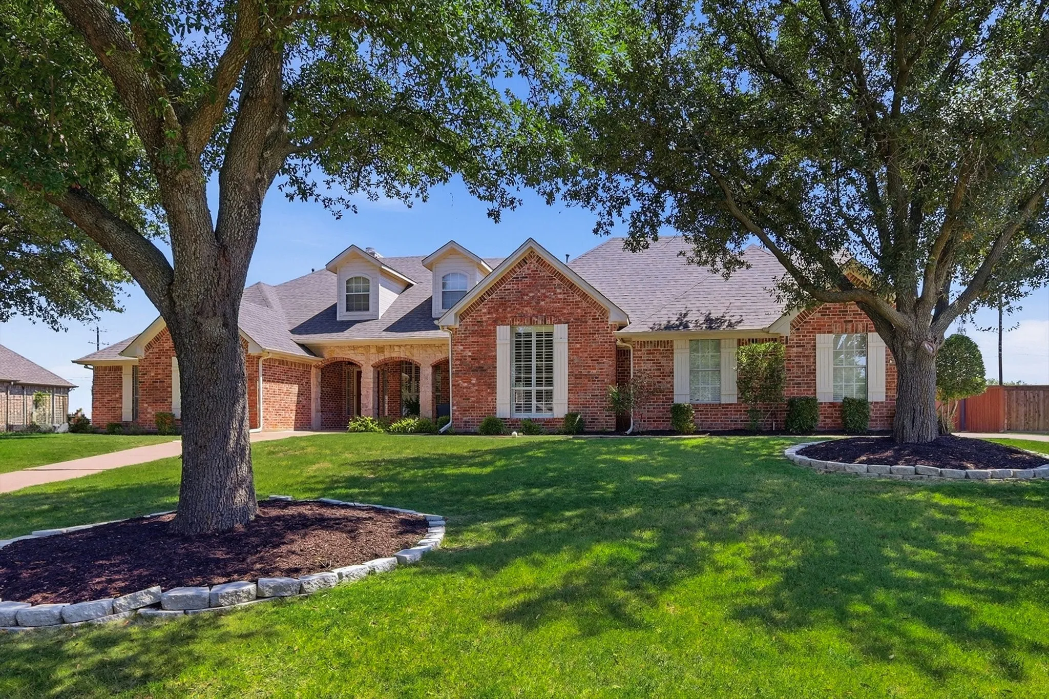 Soak in that front landscaping. Treed so beautifully
