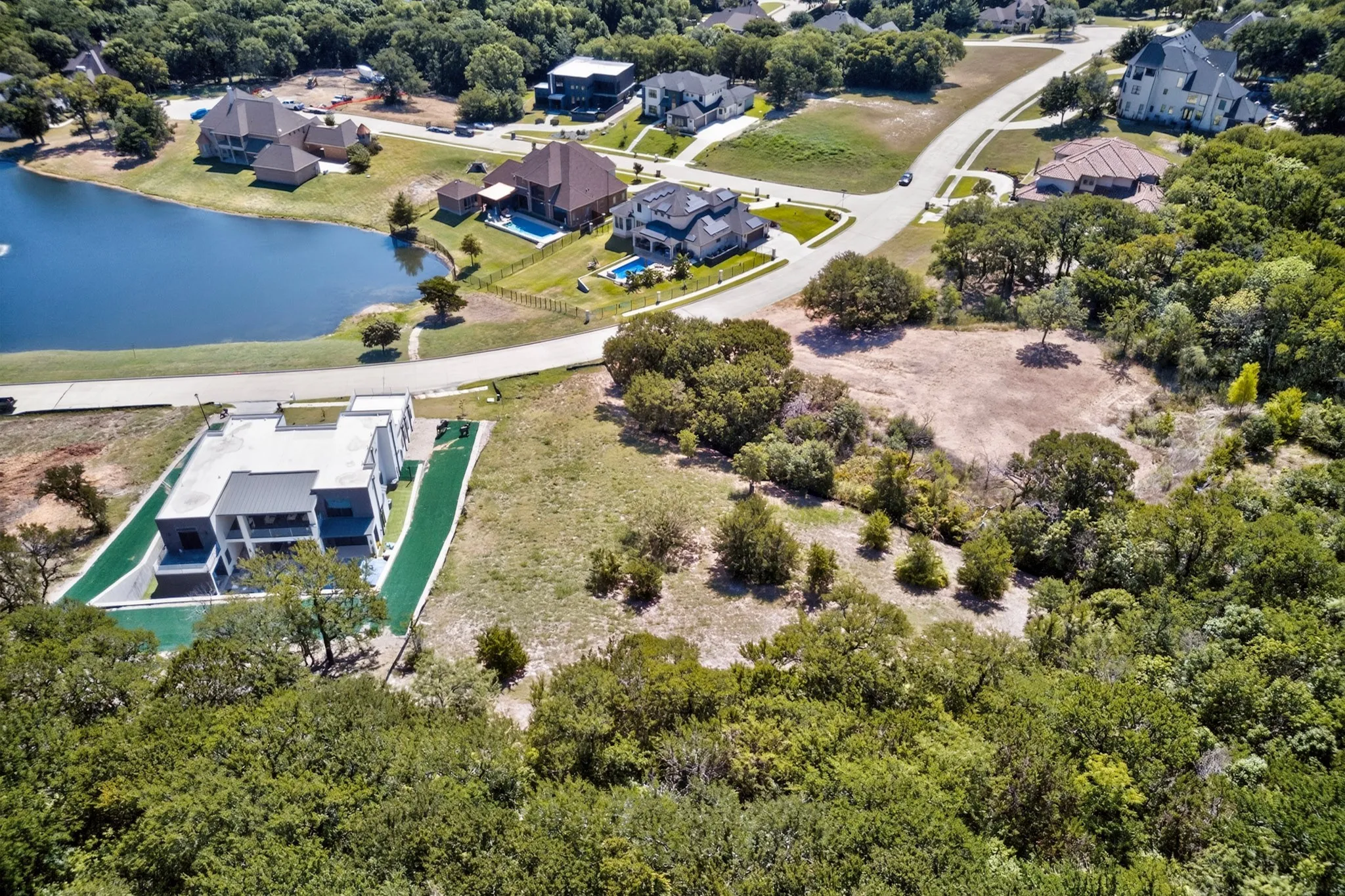 Expansive undeveloped land parcel surrounded by mature trees