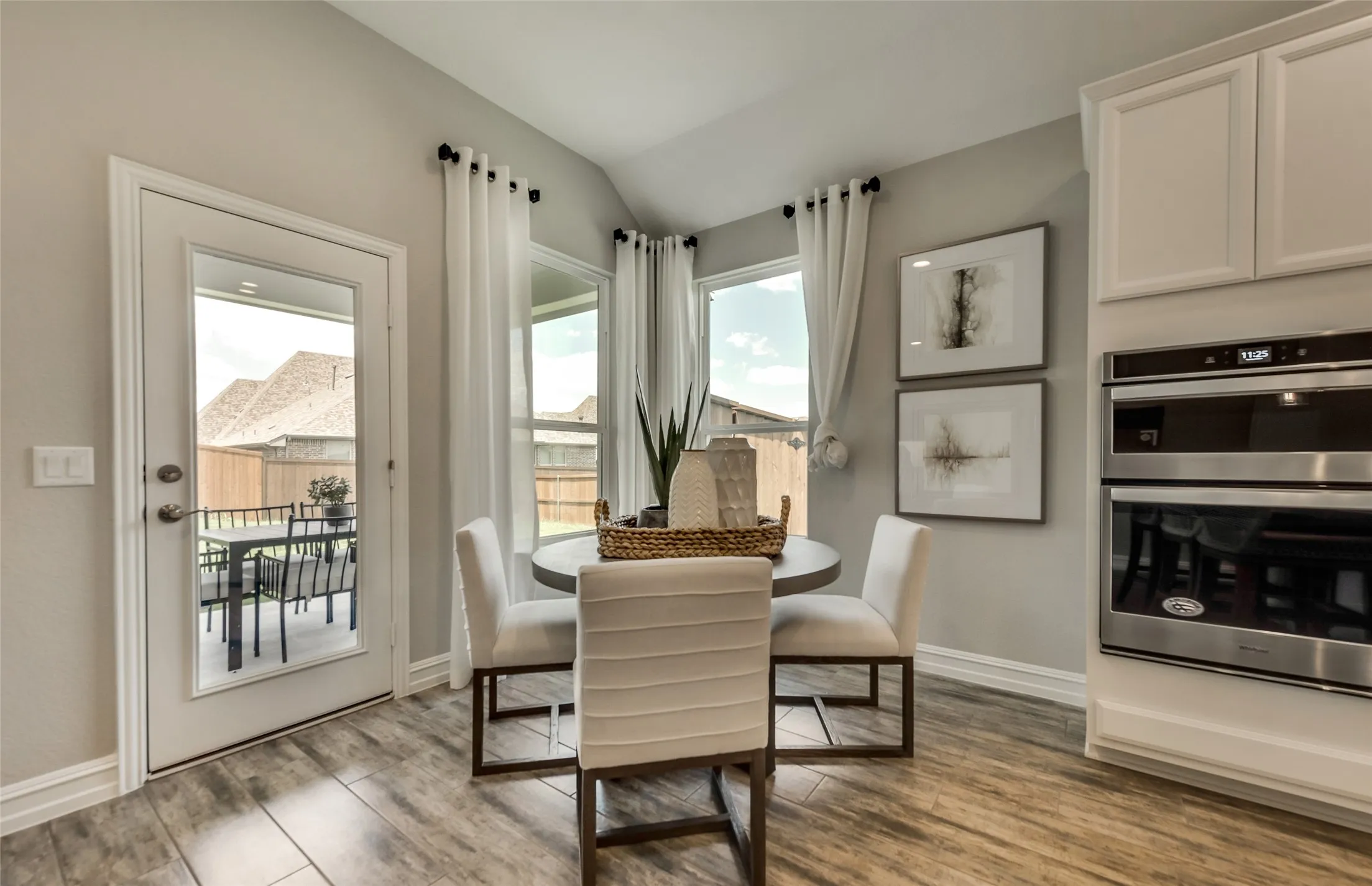 *Model Representation - Dining area off kitchen with large windows