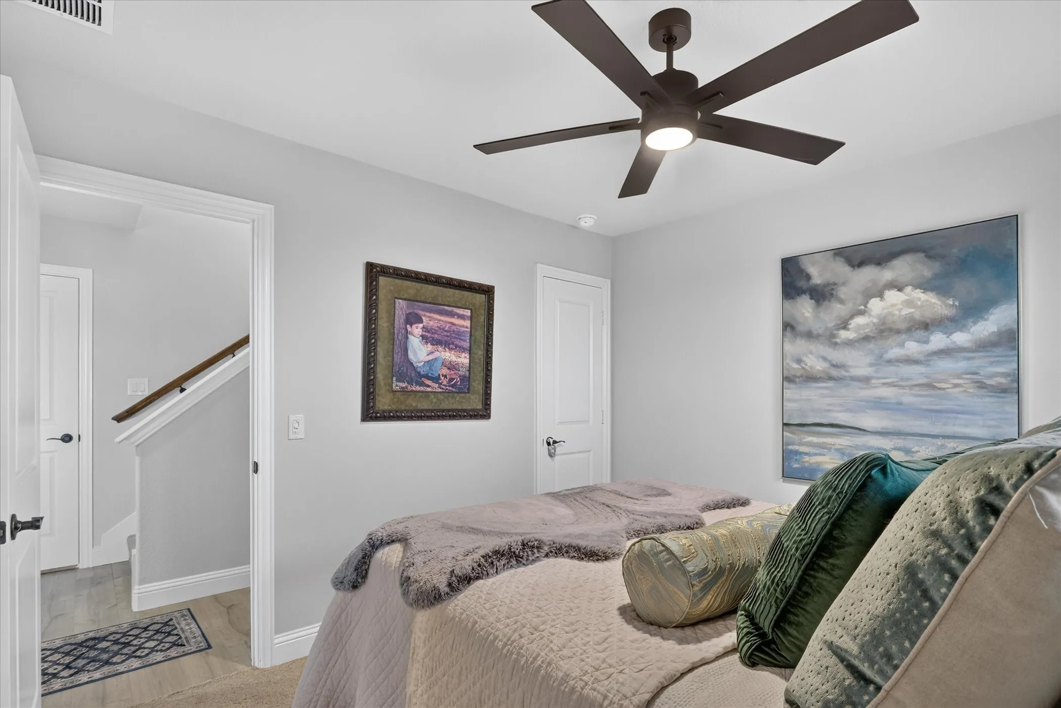 Recessed lighting and a modern ceiling fan with integrated lighting